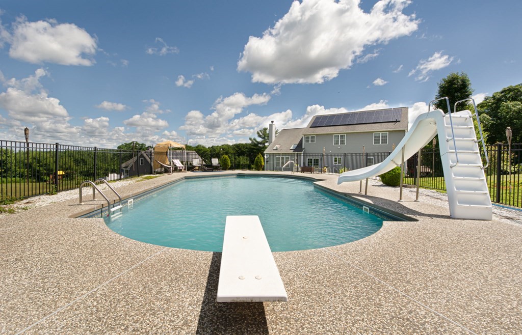 137 Osgood Road Charlton, MA 01507 - Photo 11 of 41 a view of a swimming pool with an outdoor space and seating area