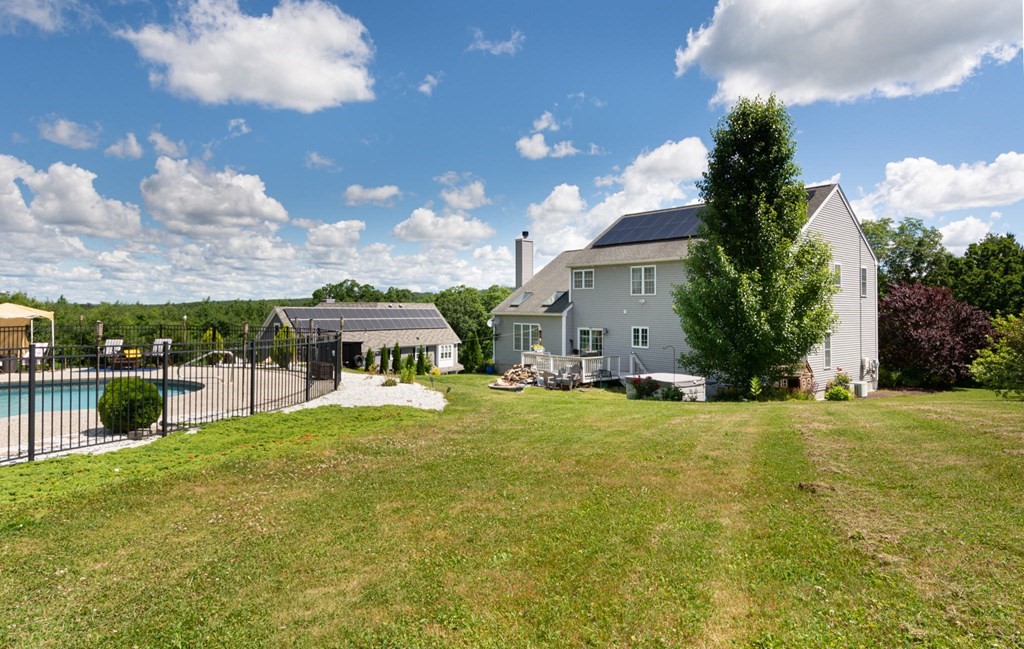 137 Osgood Road Charlton, MA 01507 - Photo 12 of 41 a view of a house with a big yard and potted plants
