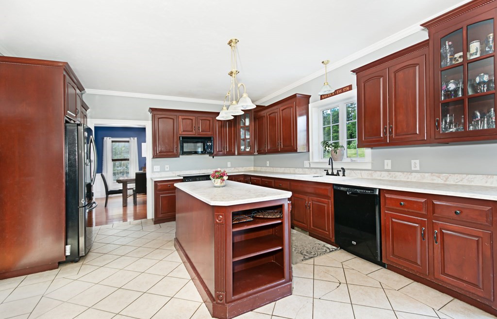 137 Osgood Road Charlton, MA 01507 - Photo 15 of 41 a kitchen with stainless steel appliances granite countertop a stove and a sink
