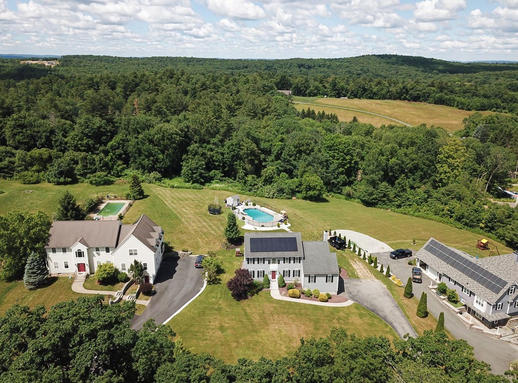 137 Osgood Road Charlton, MA 01507 - Photo 2 of 41 an aerial view of a house with a garden and lake view