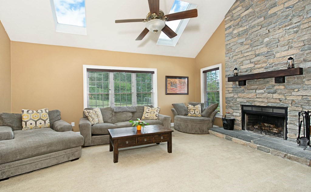 137 Osgood Road Charlton, MA 01507 - Photo 24 of 41 a living room with furniture and a fireplace