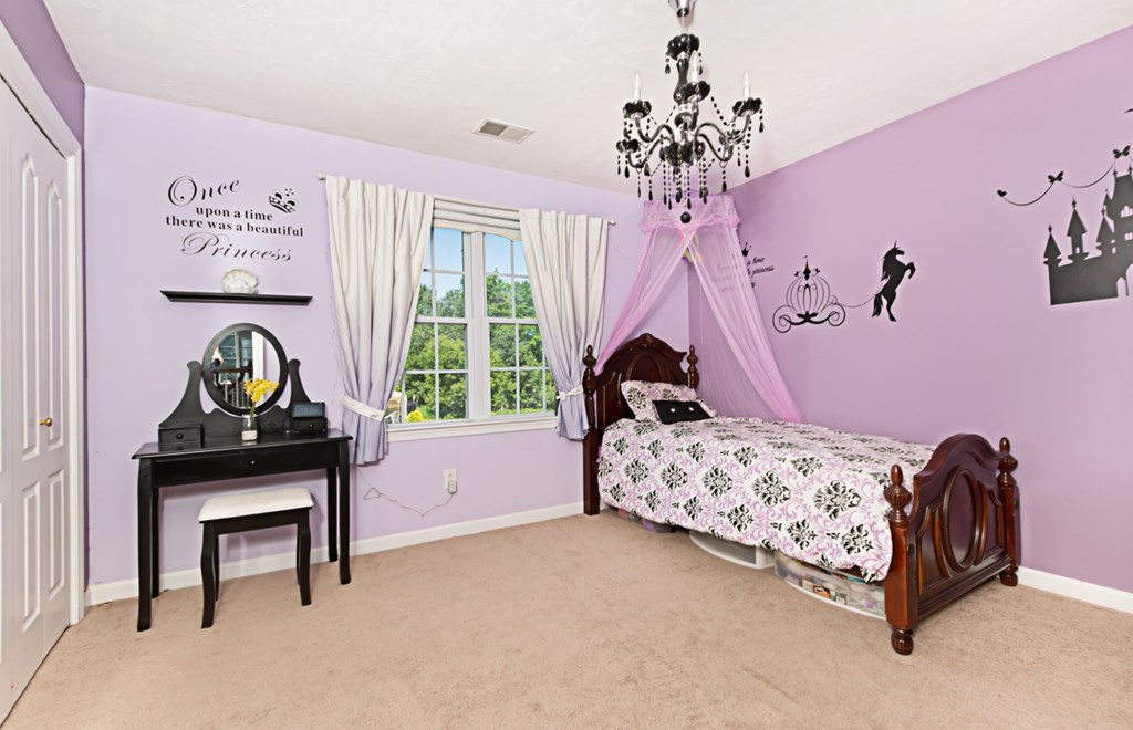 137 Osgood Road Charlton, MA 01507 - Photo 34 of 41 a bedroom with a bed and a window