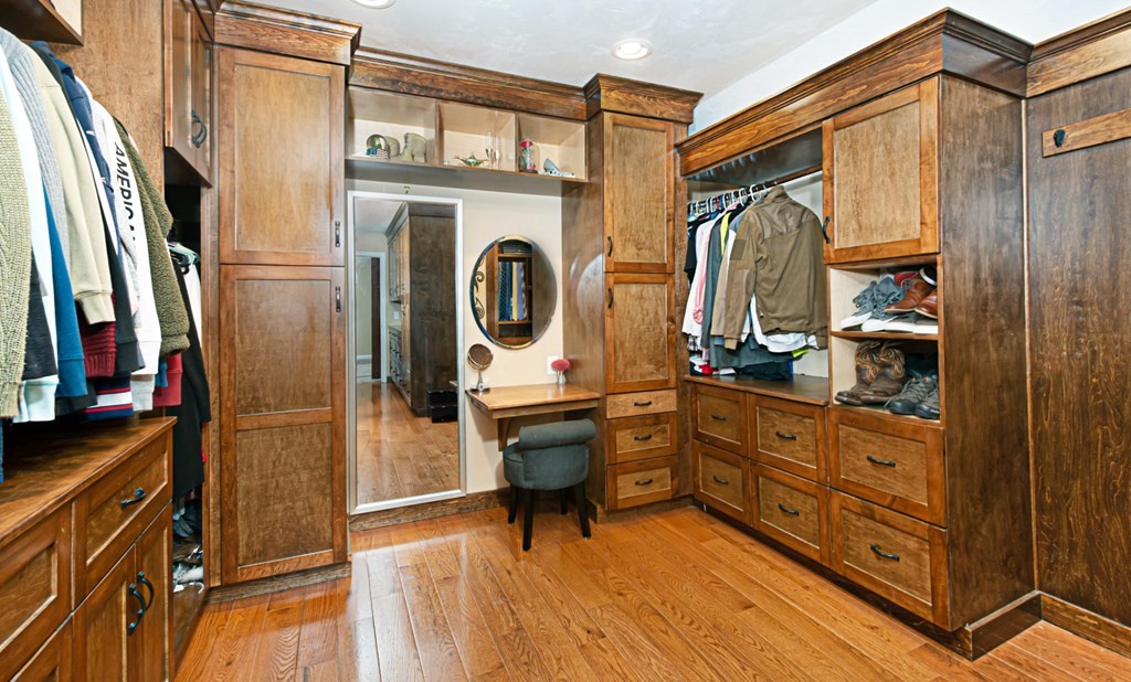 137 Osgood Road Charlton, MA 01507 - Photo 39 of 41 a room with closet a mirror and furniture