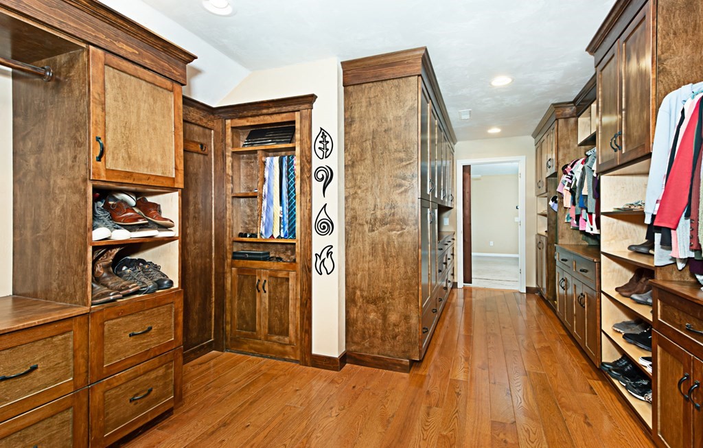 137 Osgood Road Charlton, MA 01507 - Photo 40 of 41 a view of walk in closet with clothes and shoes