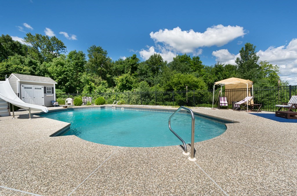 137 Osgood Road Charlton, MA 01507 - Photo 10 of 41 a view of a swimming pool with a yard