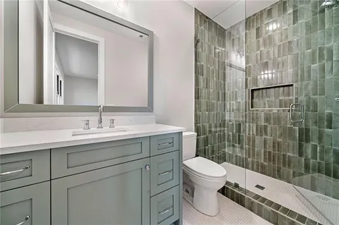 a view of an empty room with a window and closet