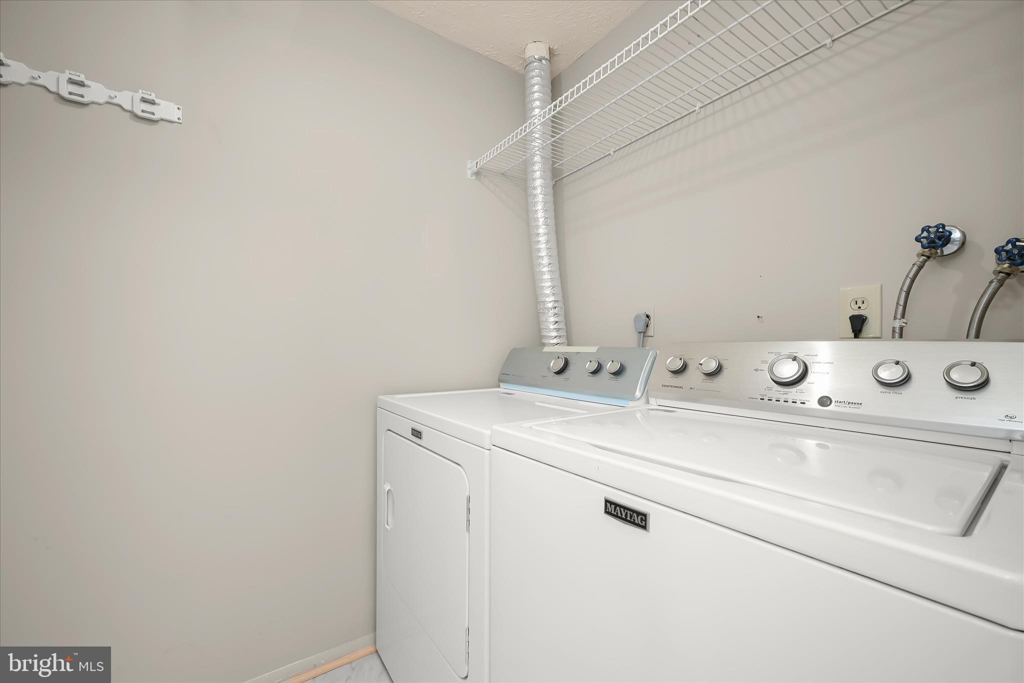 12309 Silvergate Way, Unit 908K Germantown, MD 20874 - Photo 15 of 37 a utility room with dryer and washer