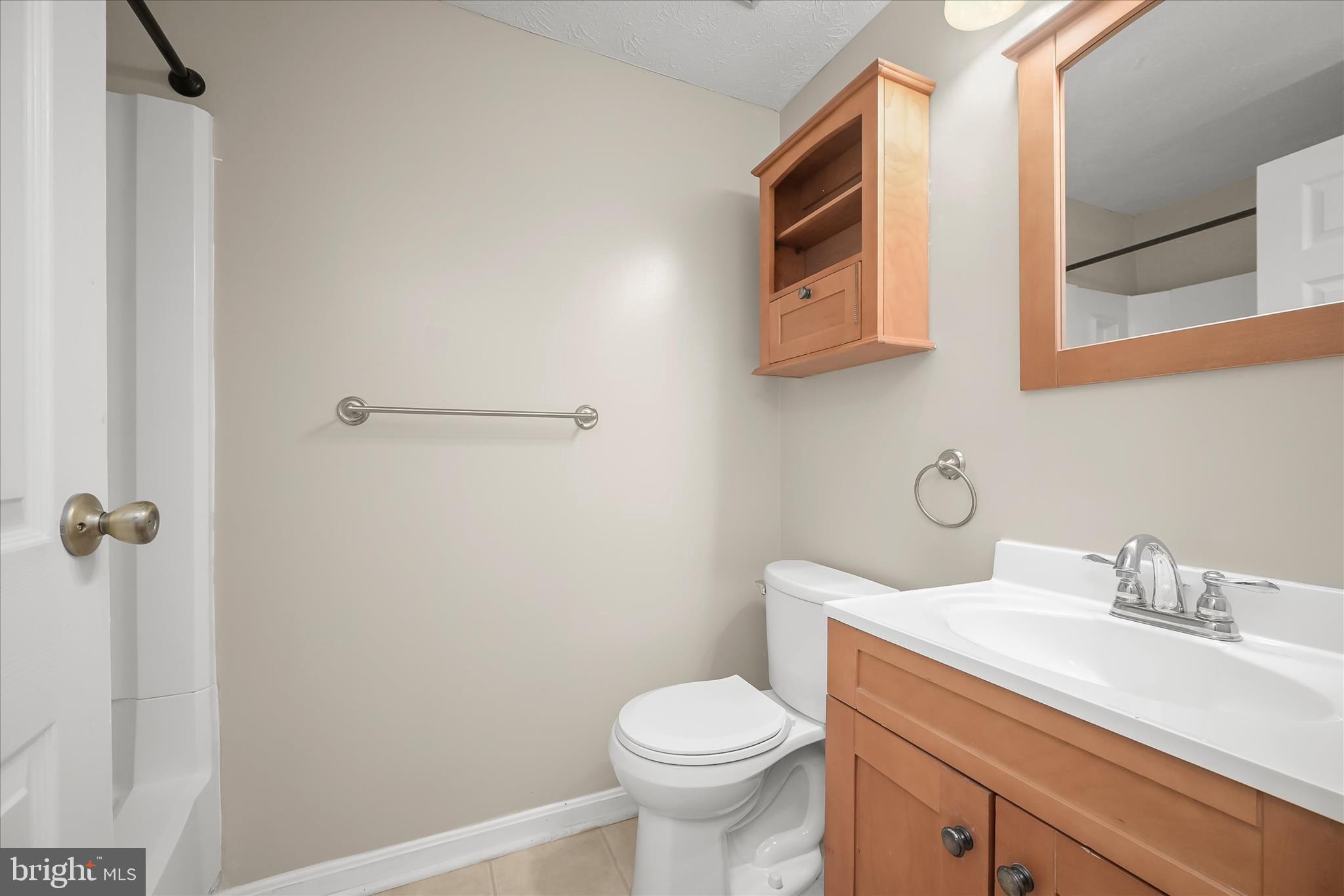 12309 Silvergate Way, Unit 908K Germantown, MD 20874 - Photo 26 of 37 a bathroom with a sink a toilet and vanity