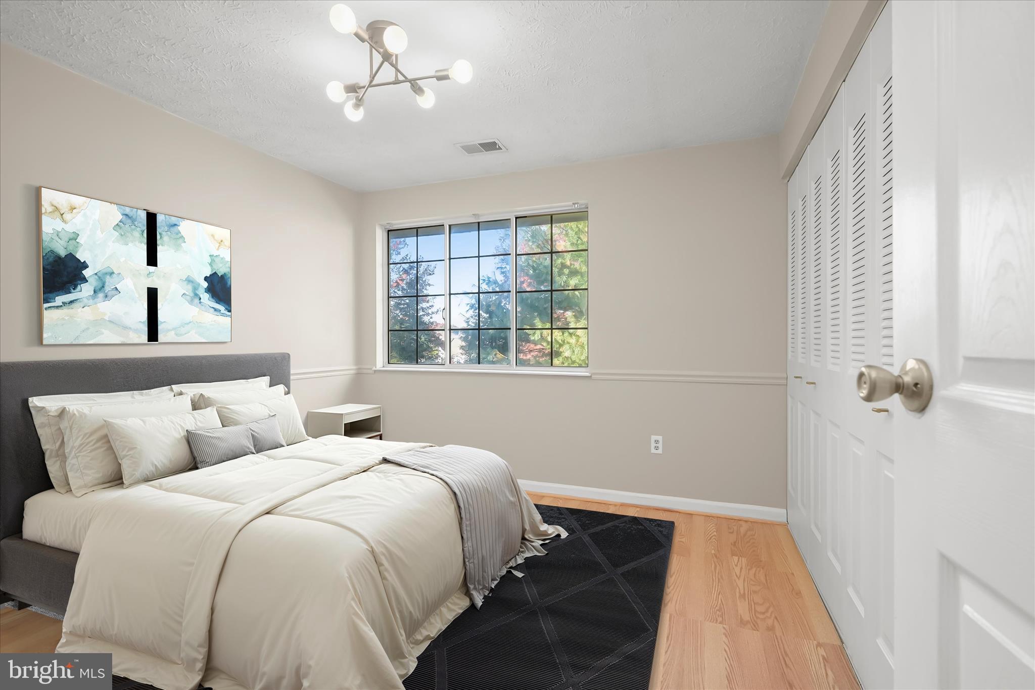 12309 Silvergate Way, Unit 908K Germantown, MD 20874 - Photo 5 of 37 a bedroom with a large bed and a window