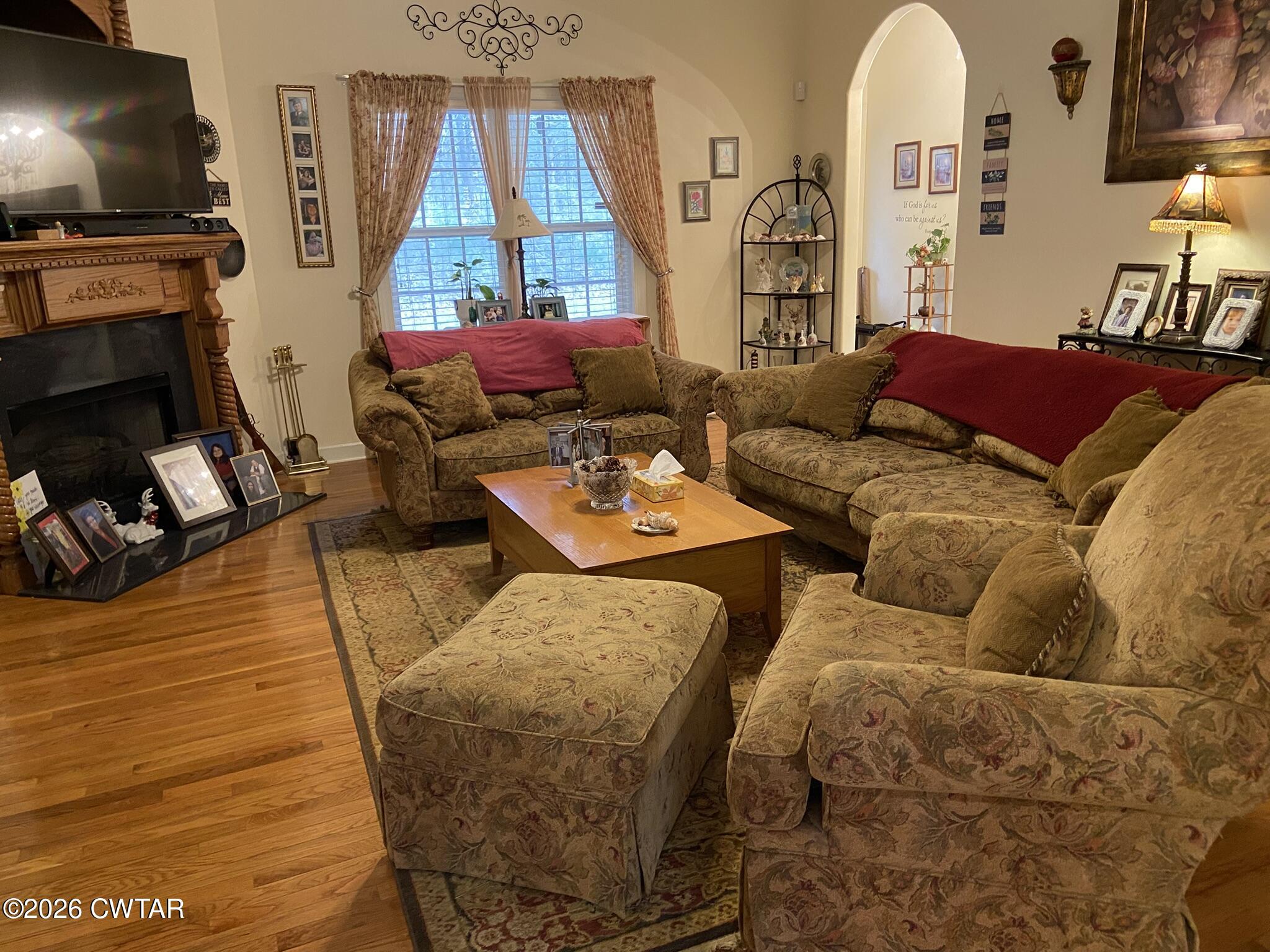 495 Knuckles Road Henderson, TN 38340 - Photo 22 of 80 a living room with furniture and a flat screen tv