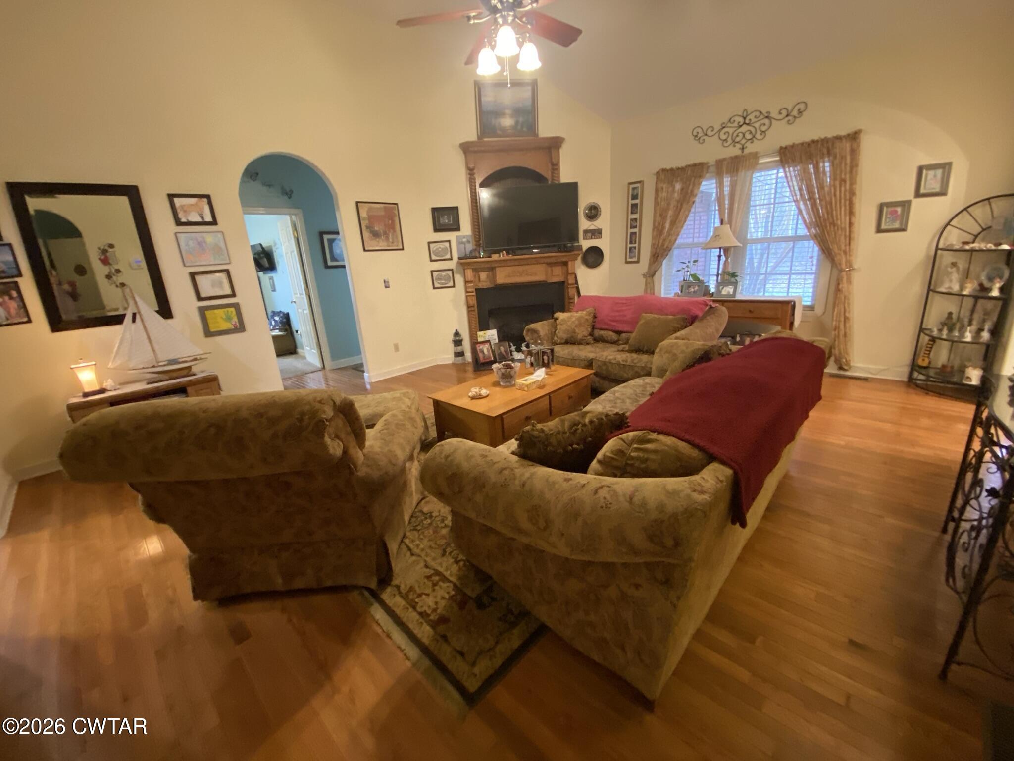495 Knuckles Road Henderson, TN 38340 - Photo 23 of 80 a living room with furniture and a chandelier