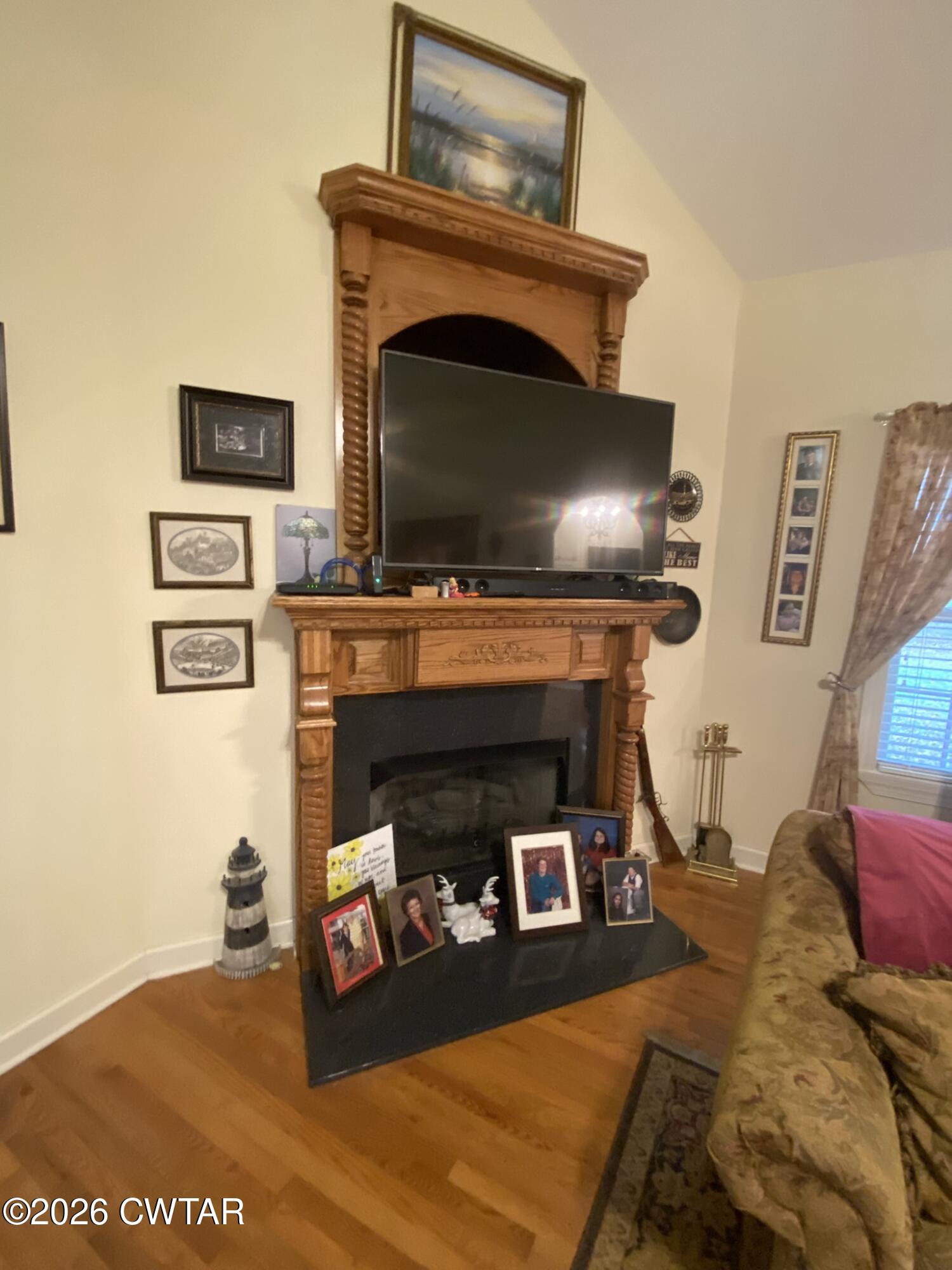 495 Knuckles Road Henderson, TN 38340 - Photo 24 of 80 a living room with furniture and a fireplace
