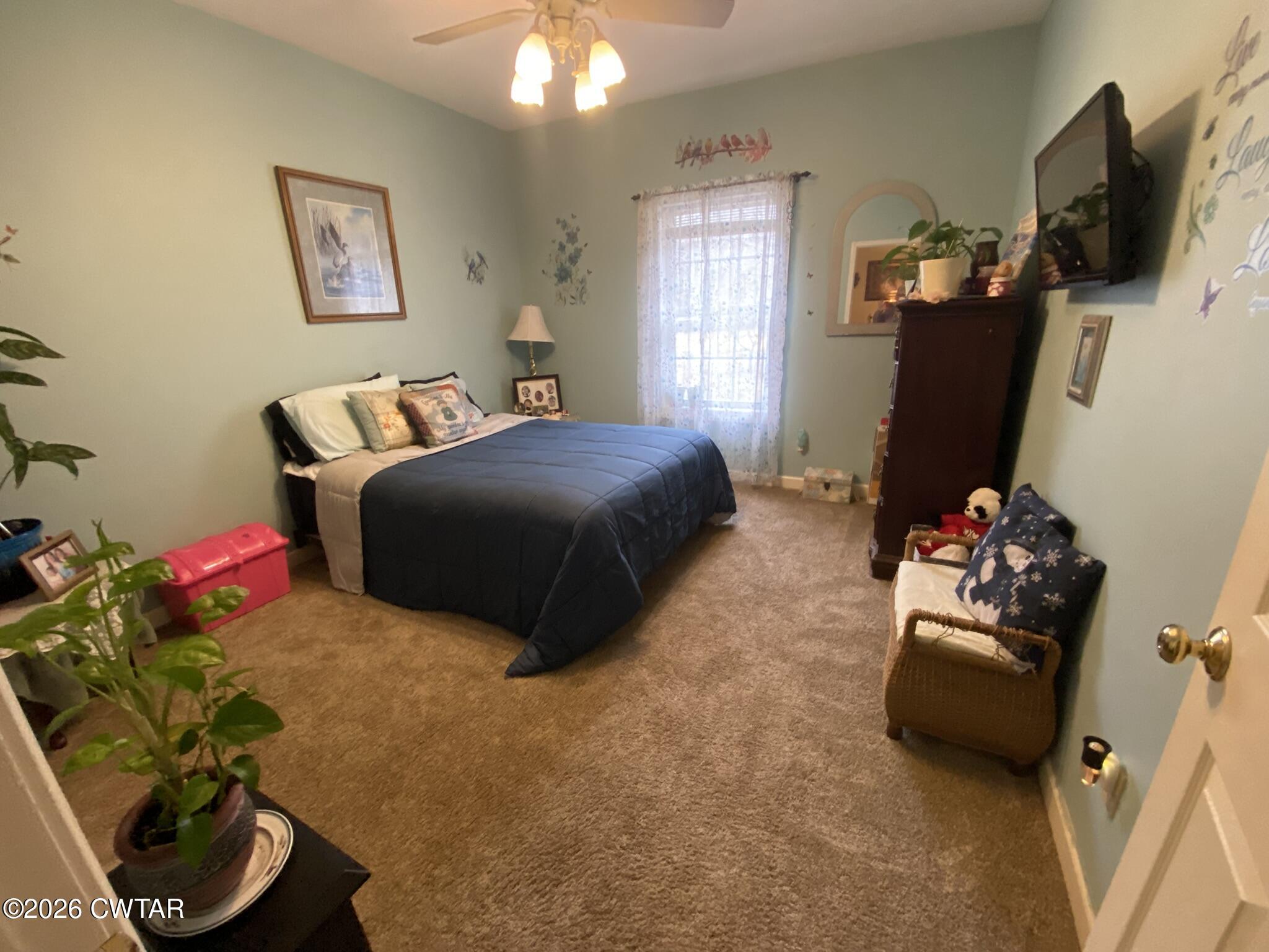 495 Knuckles Road Henderson, TN 38340 - Photo 29 of 80 a bedroom with bed and window