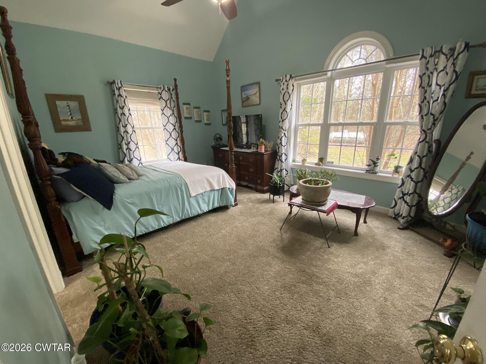 495 Knuckles Road Henderson, TN 38340 - Photo 31 of 80 a bedroom with a bed a couch and dresser