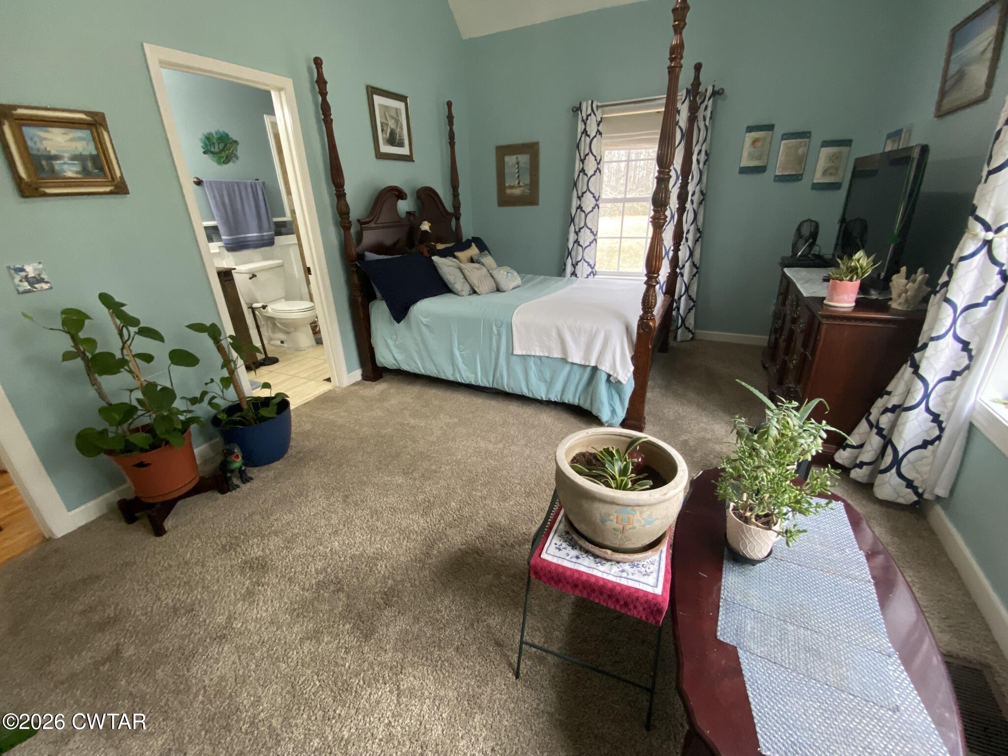 495 Knuckles Road Henderson, TN 38340 - Photo 32 of 80 a living room with furniture and a potted plant