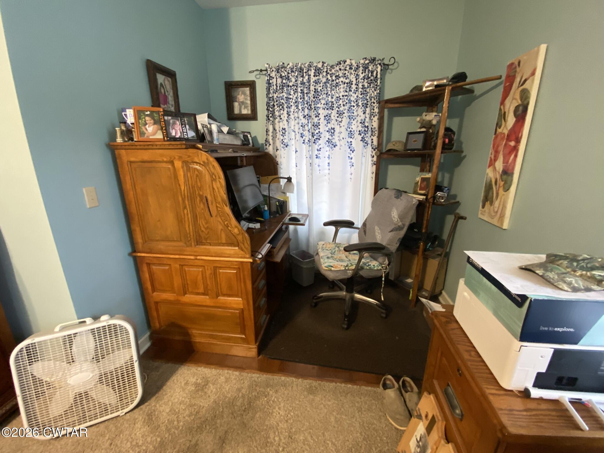 495 Knuckles Road Henderson, TN 38340 - Photo 36 of 80 a living room with furniture and a flat screen tv