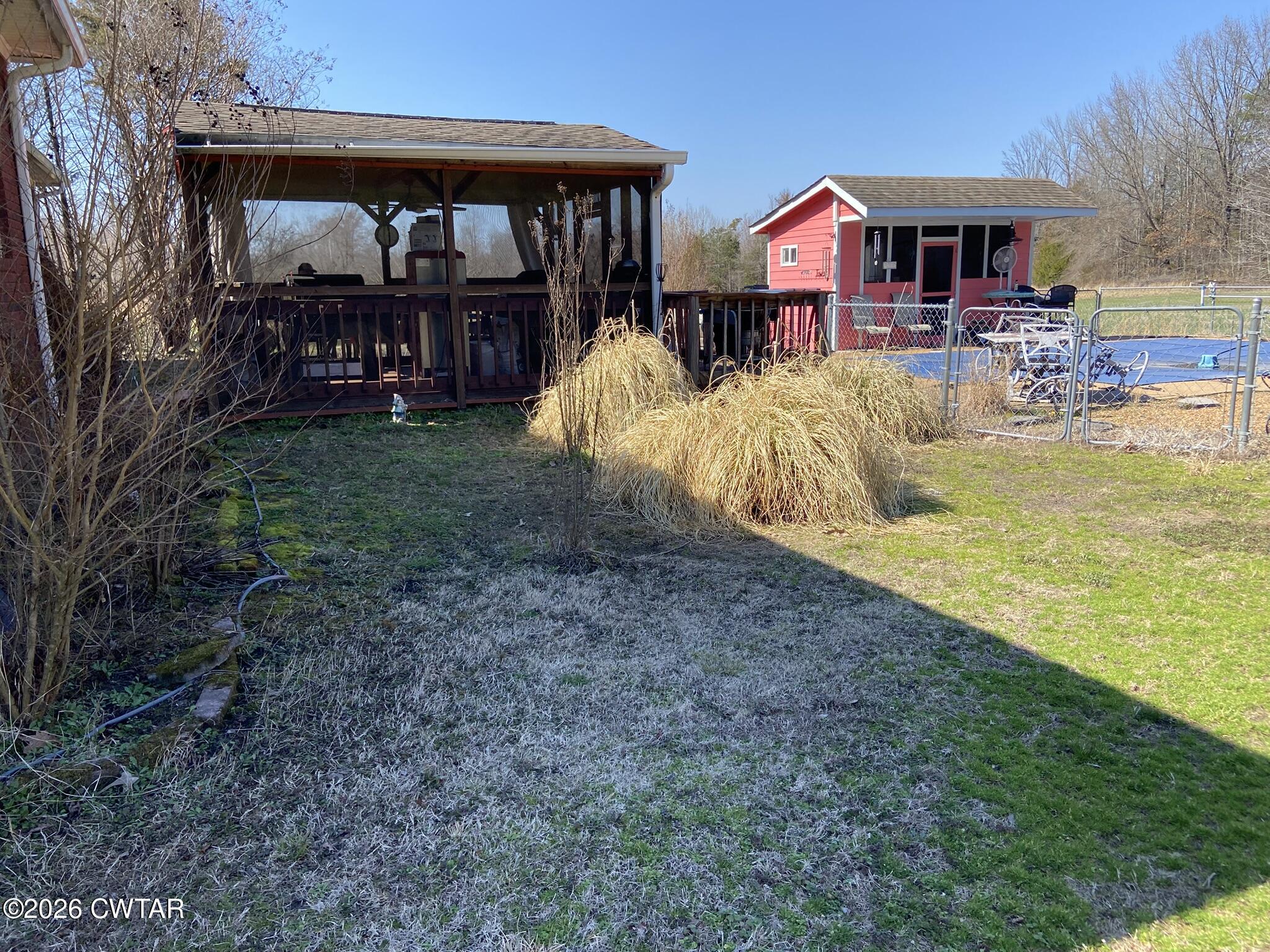 495 Knuckles Road Henderson, TN 38340 - Photo 43 of 80 a view of a house with a yard patio and furniture