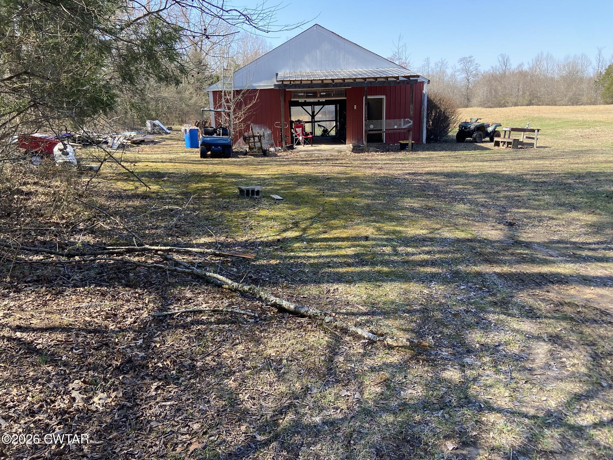 495 Knuckles Road Henderson, TN 38340 - Photo 45 of 80 a view of a house with a yard and sitting area