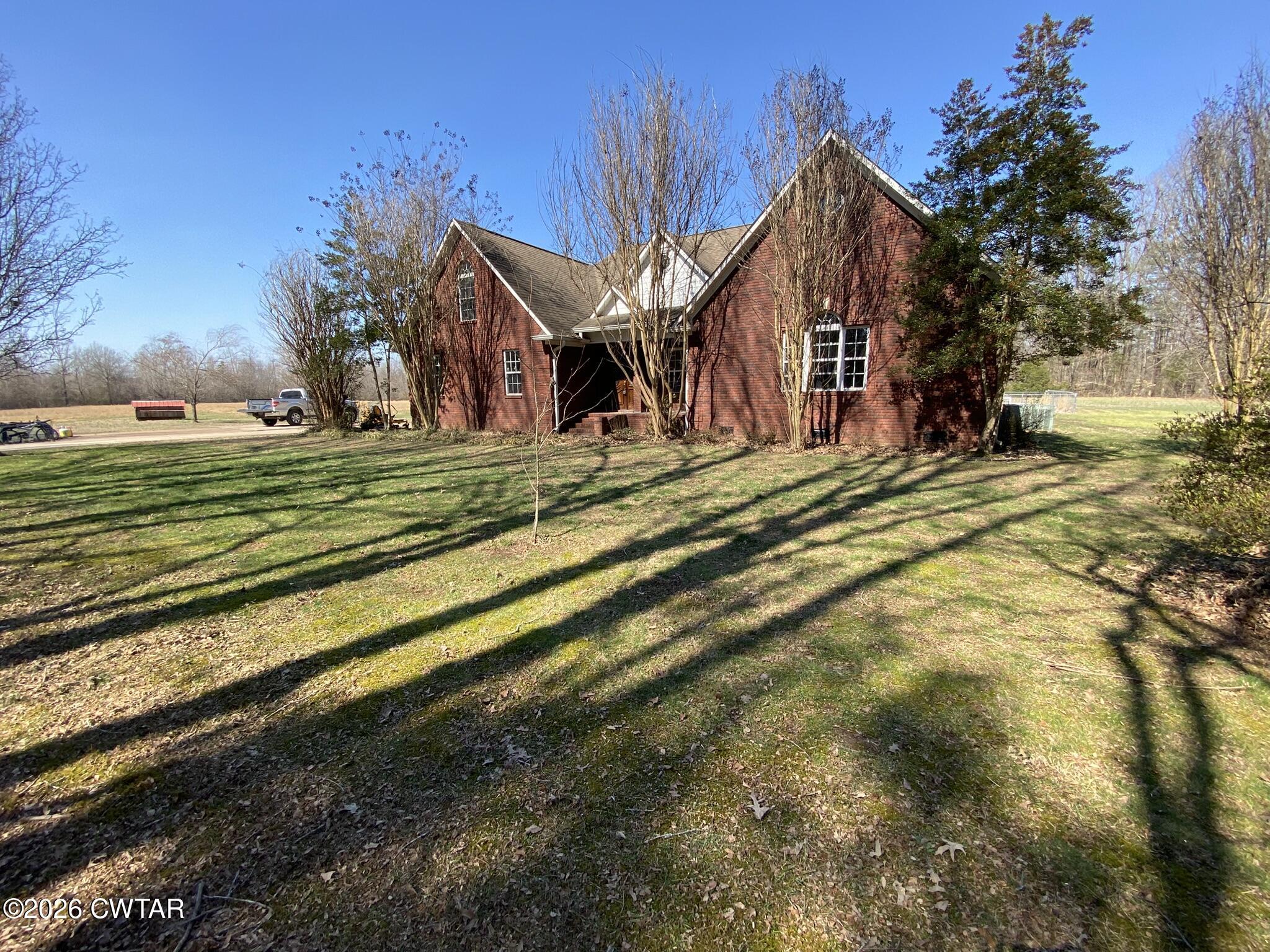 495 Knuckles Road Henderson, TN 38340 - Photo 51 of 80 a view of a house with a yard