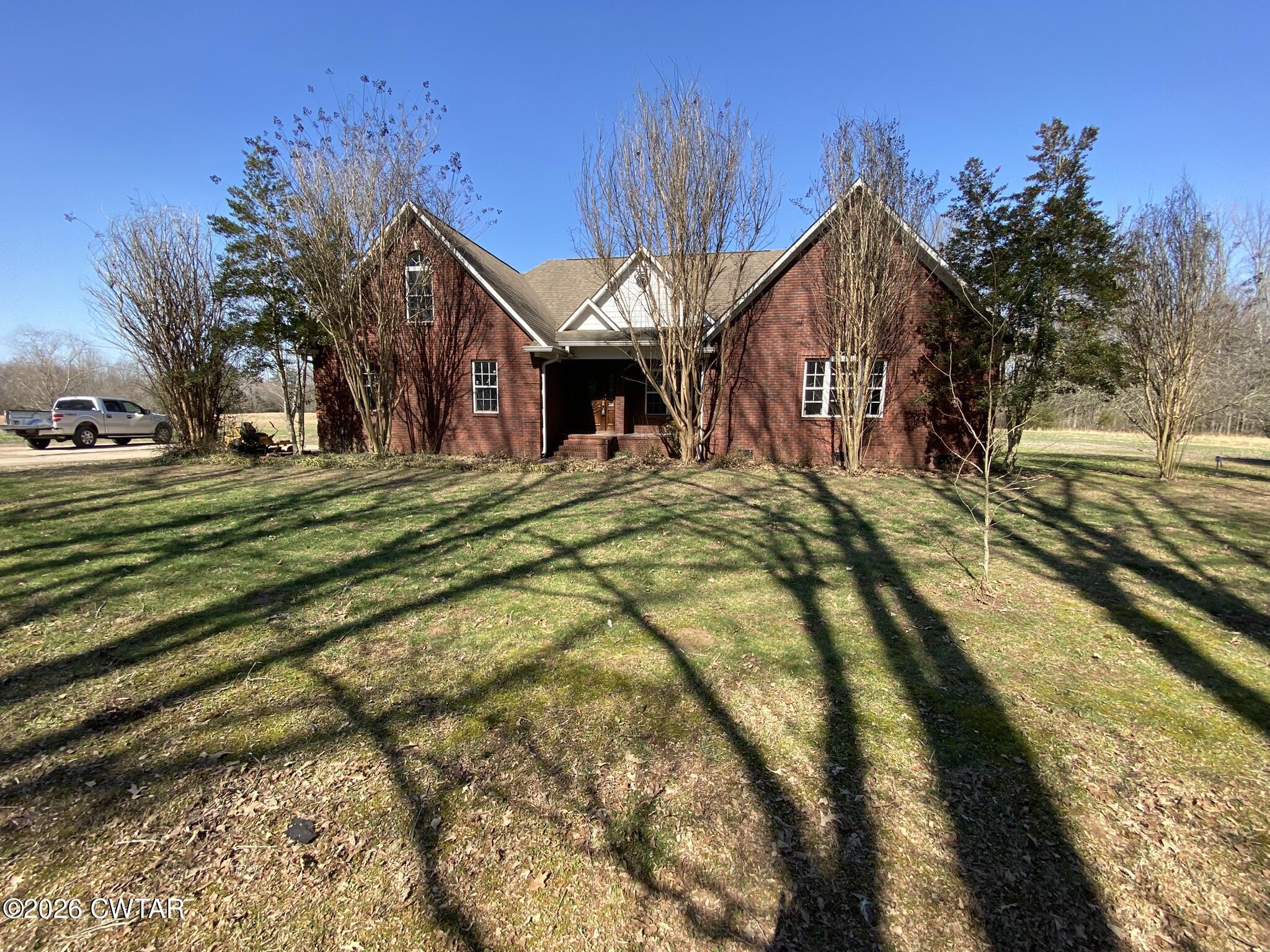 495 Knuckles Road Henderson, TN 38340 - Photo 52 of 80 a front view of a house with a yard