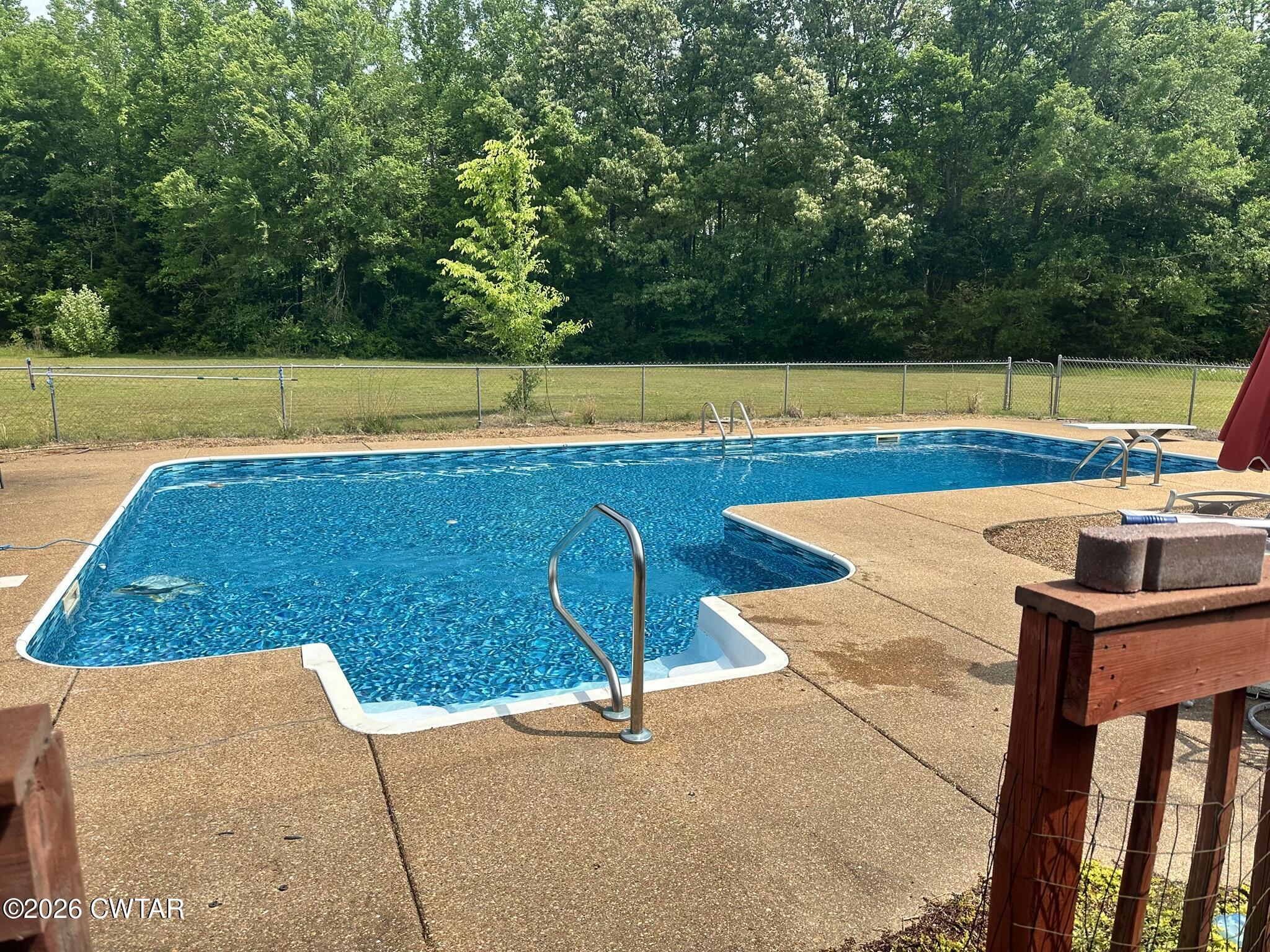 495 Knuckles Road Henderson, TN 38340 - Photo 88 of 90 a view of a swimming pool with a yard