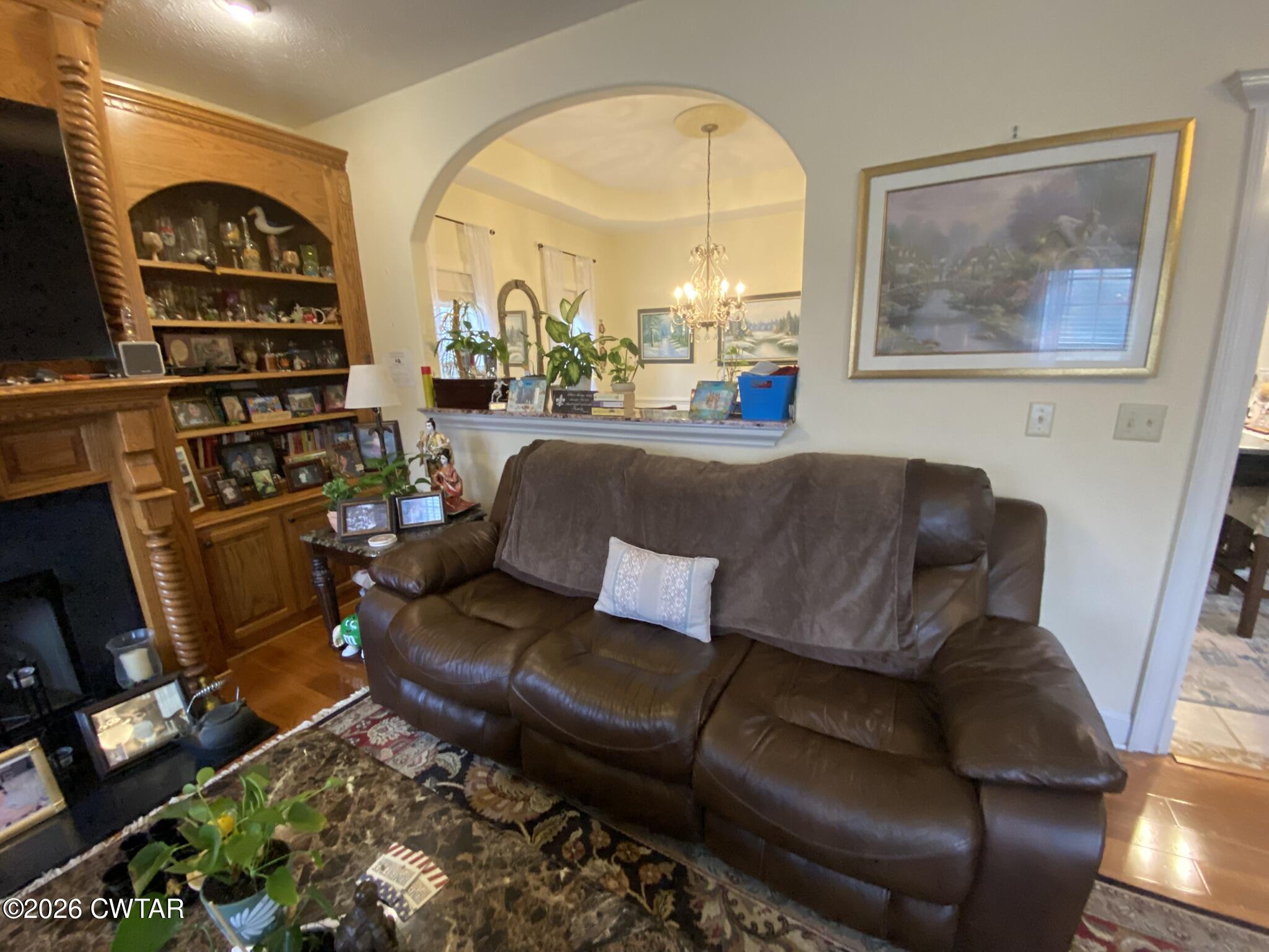 495 Knuckles Road Henderson, TN 38340 - Photo 9 of 80 a living room with furniture a rug and a large window