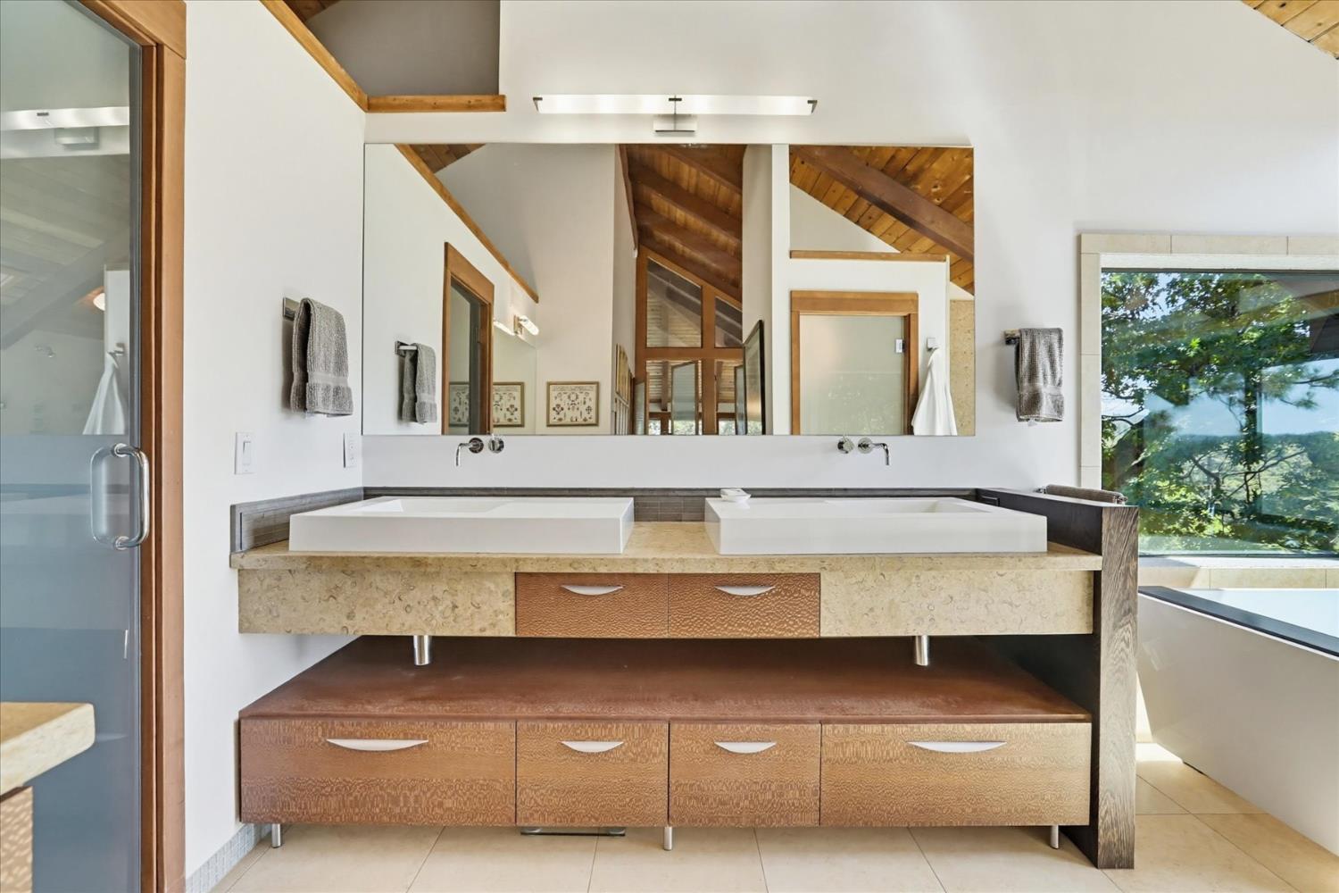 20111 Tanglewood Road Grass Valley, CA 95945 - Photo 39 of 93 a bathroom with a sink and a mirror