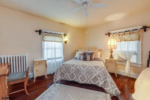 a bedroom with a bed and a lamp
