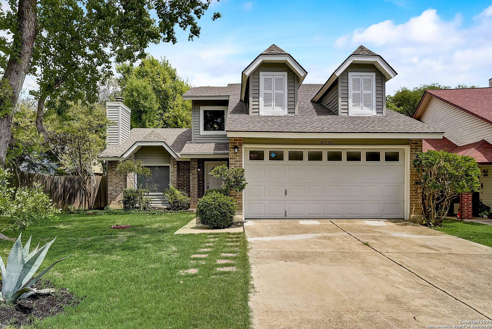 9710 Fortune Ridge Drive Converse, TX 78109 - Photo 1 of 1 a front view of a house with a yard