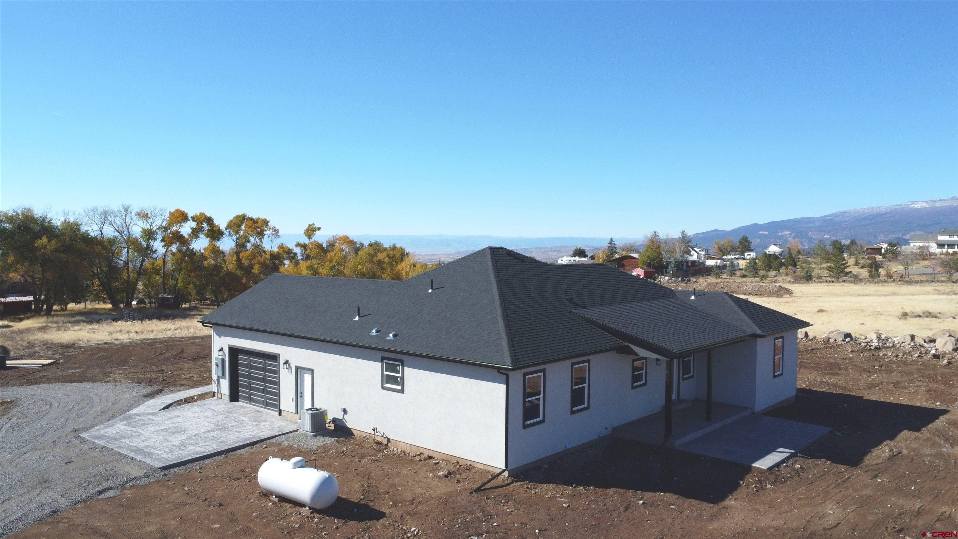 18383 2375 Road Cedaredge, CO 81413 - Photo 11 of 18 a view of a house with a ocean view