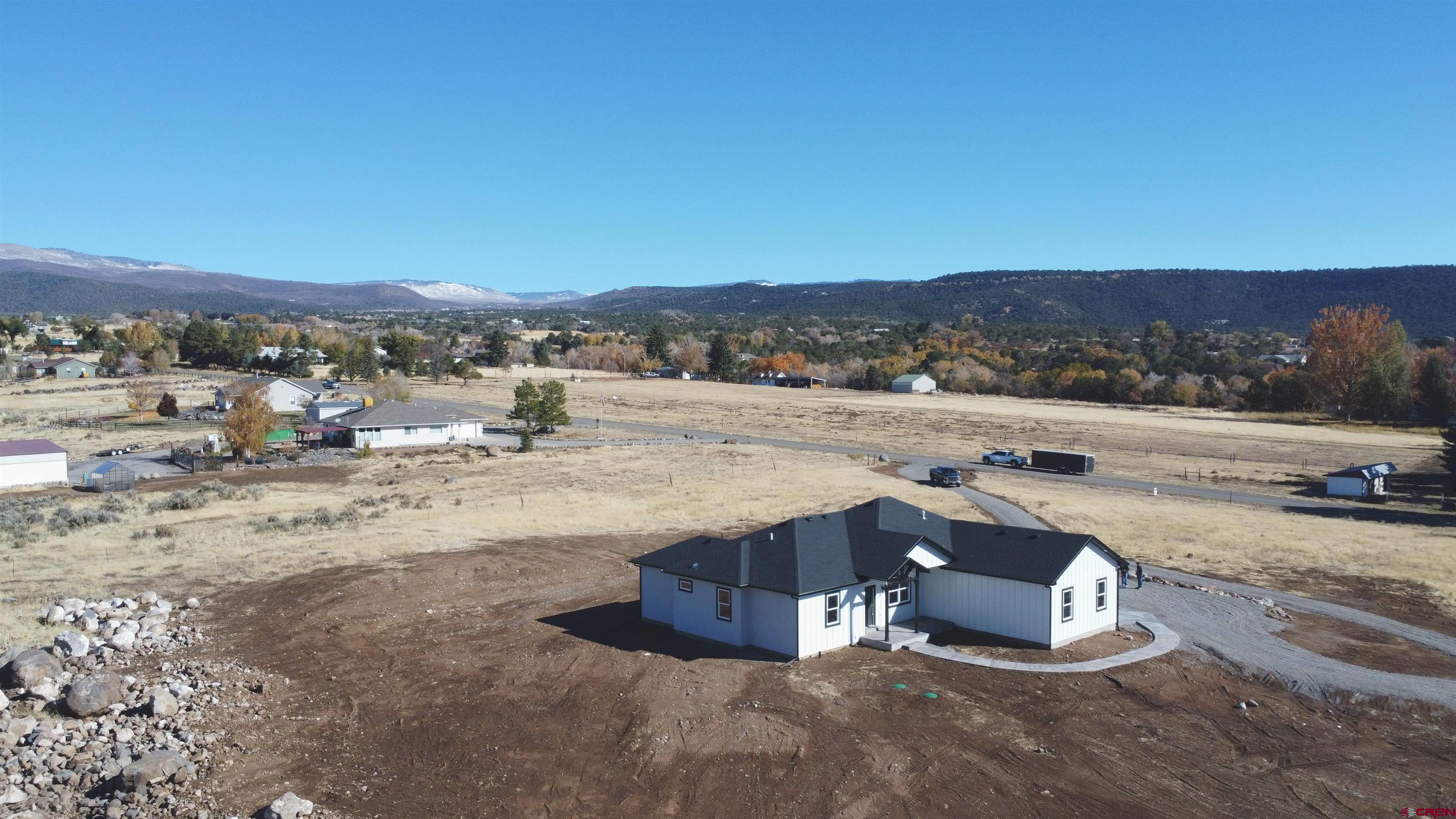 18383 2375 Road Cedaredge, CO 81413 - Photo 12 of 18 a view of a lake with a city