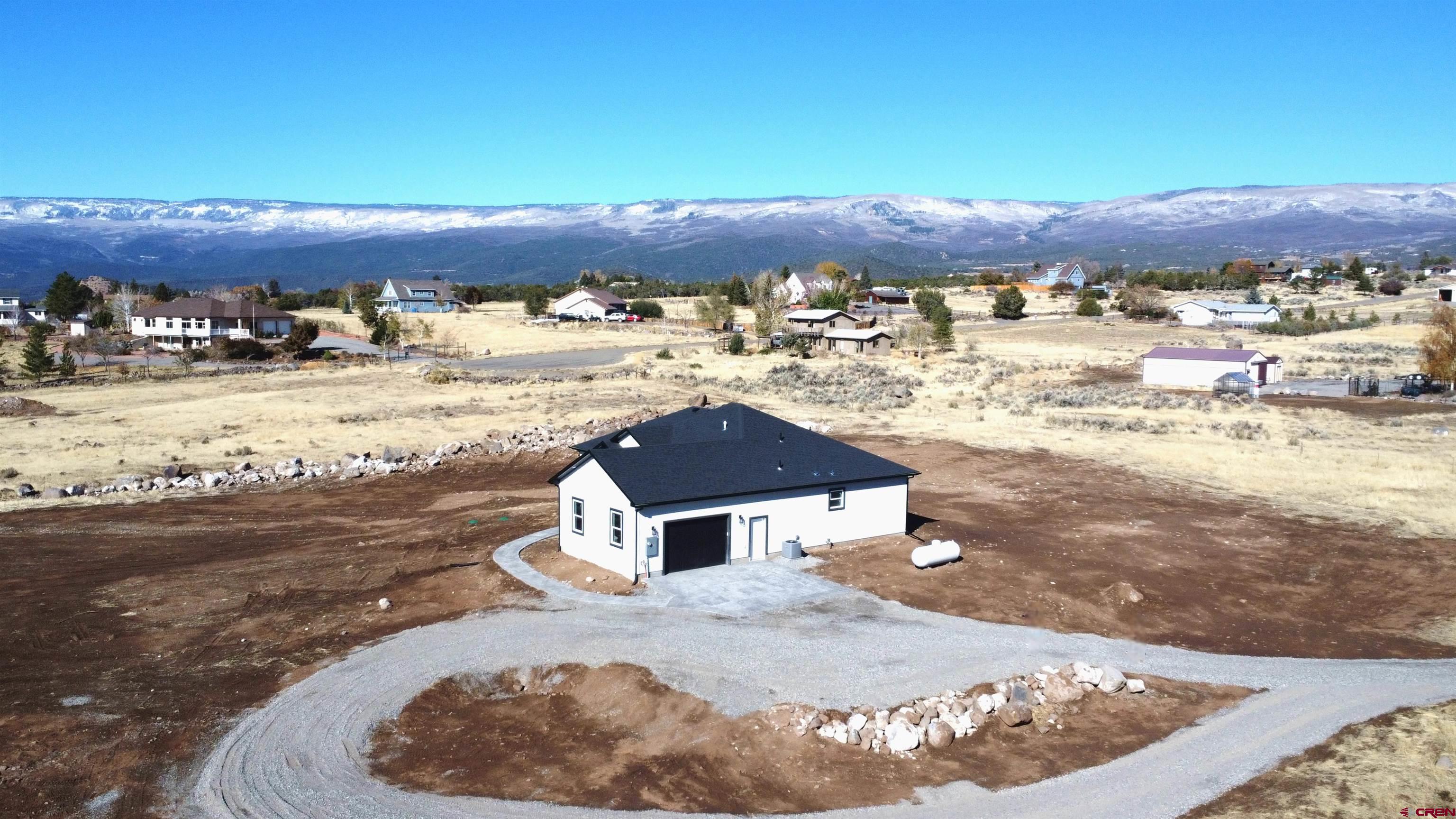 18383 2375 Road Cedaredge, CO 81413 - Photo 17 of 18 swimming pool view with a lake view