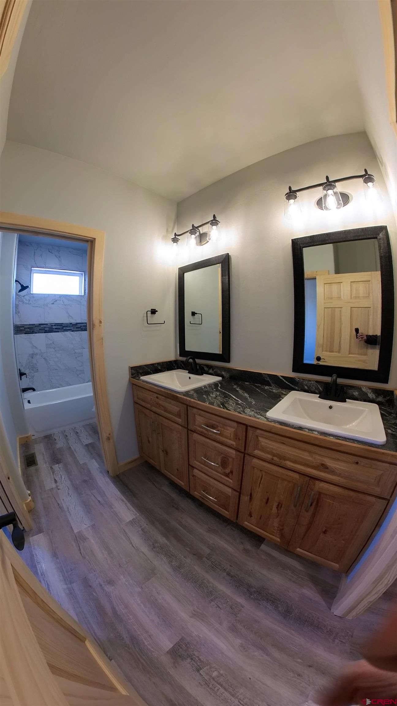 18383 2375 Road Cedaredge, CO 81413 - Photo 9 of 18 a living room with furniture and a flat screen tv