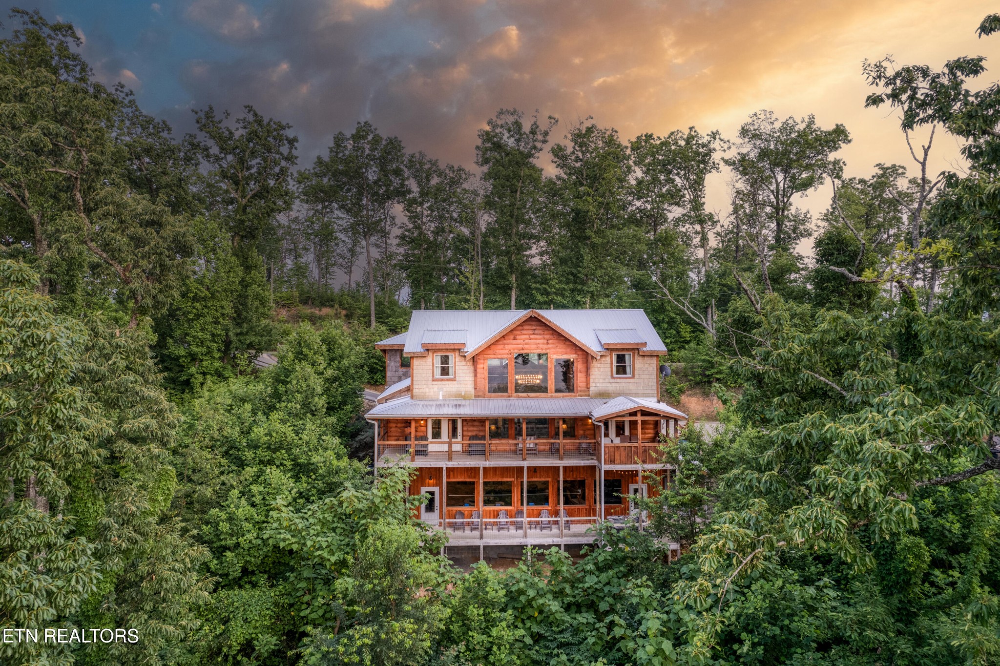 809 Pinecrest Way Sevierville, TN 37862 - Photo 56 of 60 a view of a big house with a big yard and large trees