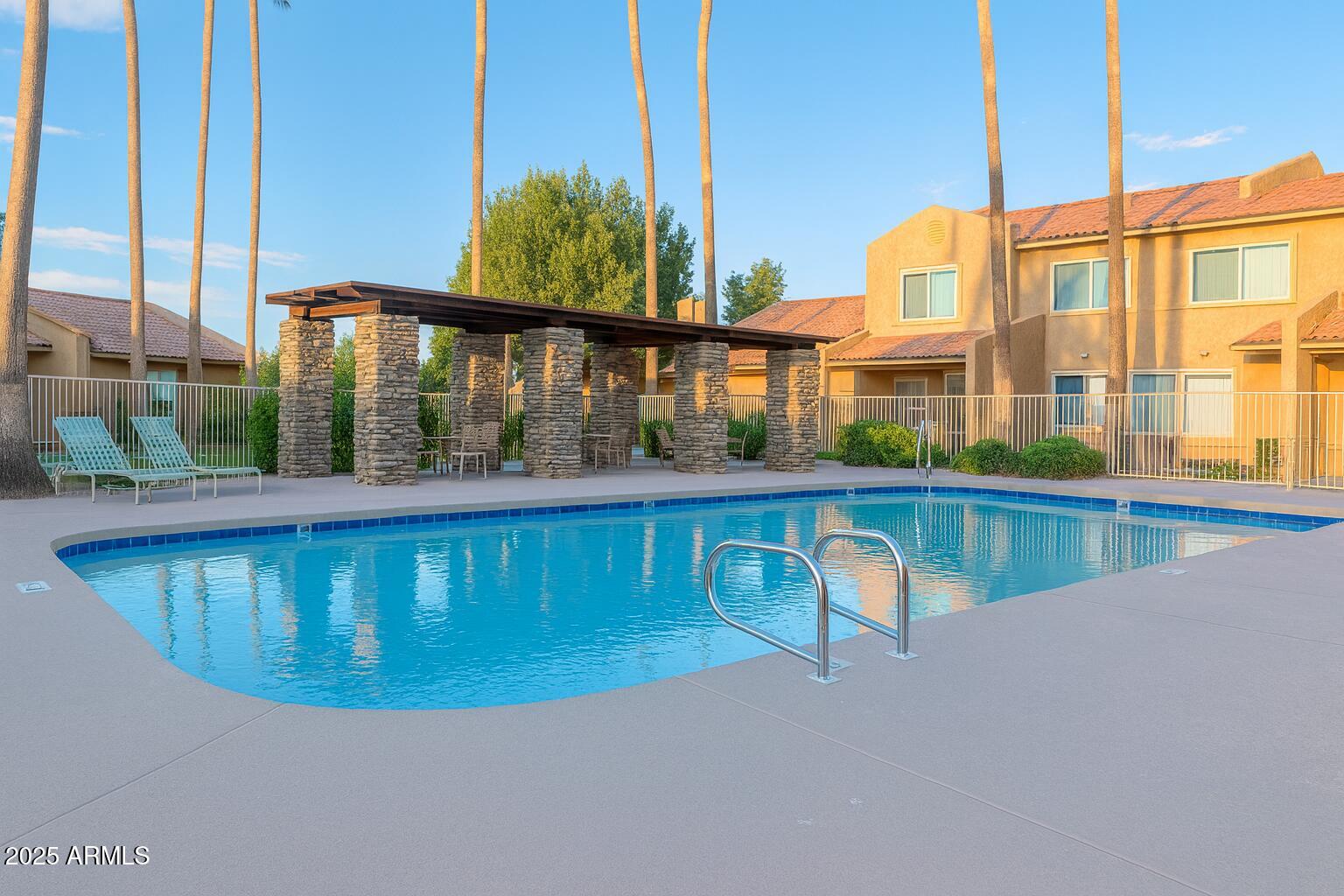 3511 East Baseline Road, Unit 1213 Phoenix, AZ 85042 - Photo 19 of 19 a view of a swimming pool with a yard