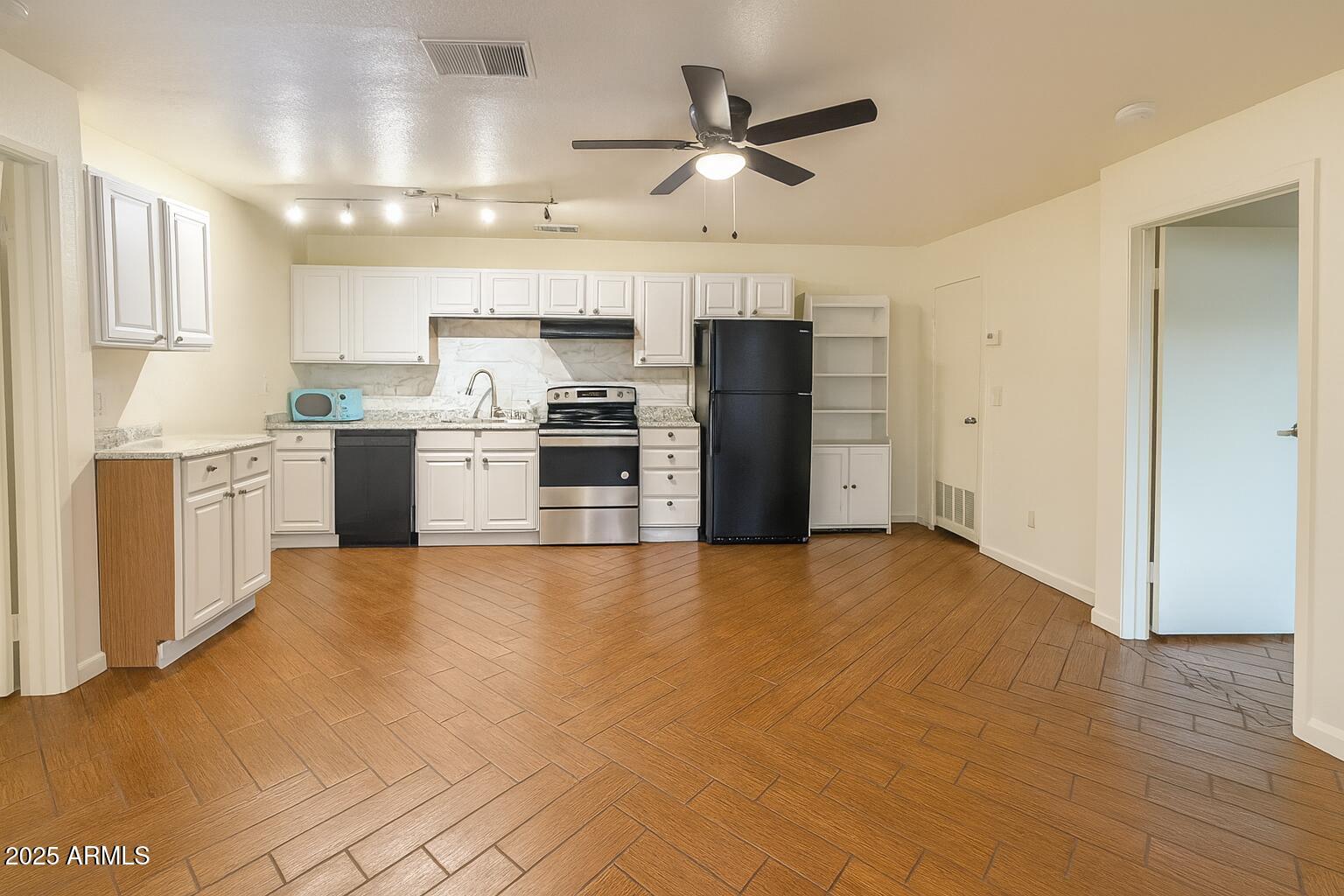 3511 East Baseline Road, Unit 1213 Phoenix, AZ 85042 - Photo 7 of 19 a view of a kitchen with a sink stainless steel appliances