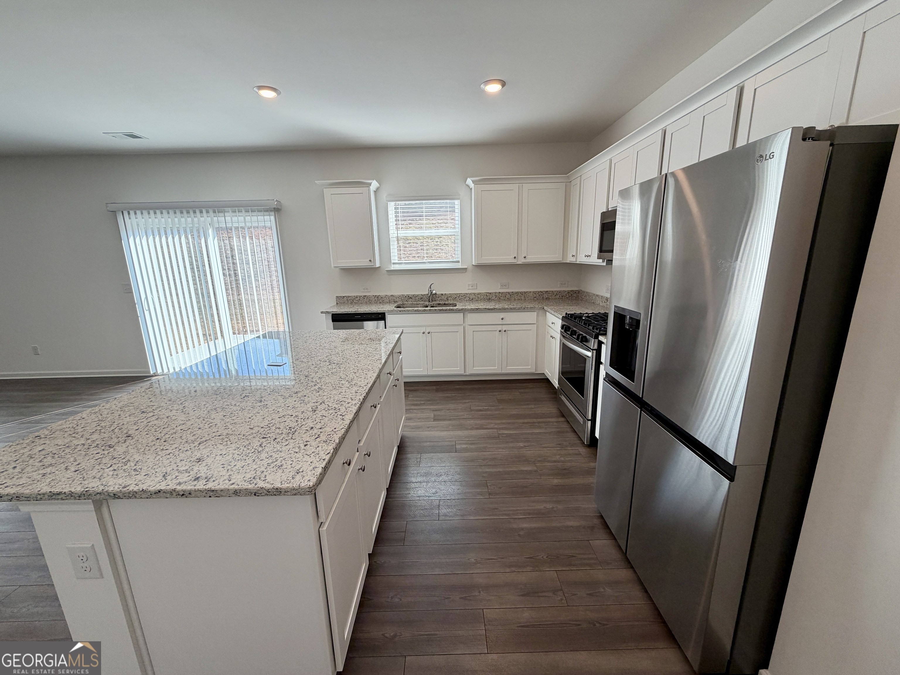 788 Gelderland Drive Hampton, GA 30228 - Photo 11 of 27 a kitchen with stainless steel appliances granite countertop refrigerator a sink and dishwasher