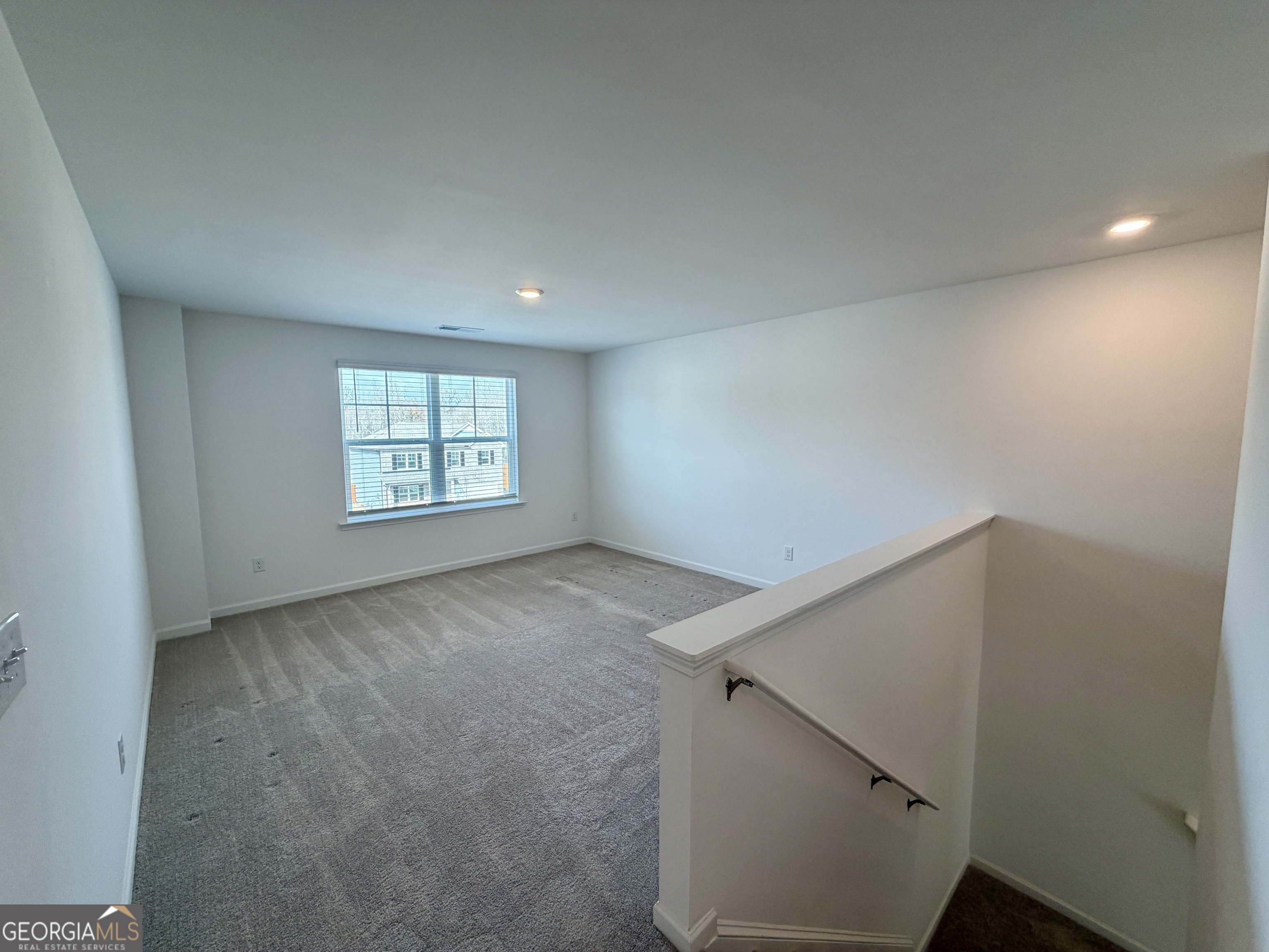 788 Gelderland Drive Hampton, GA 30228 - Photo 13 of 27 an empty room with windows