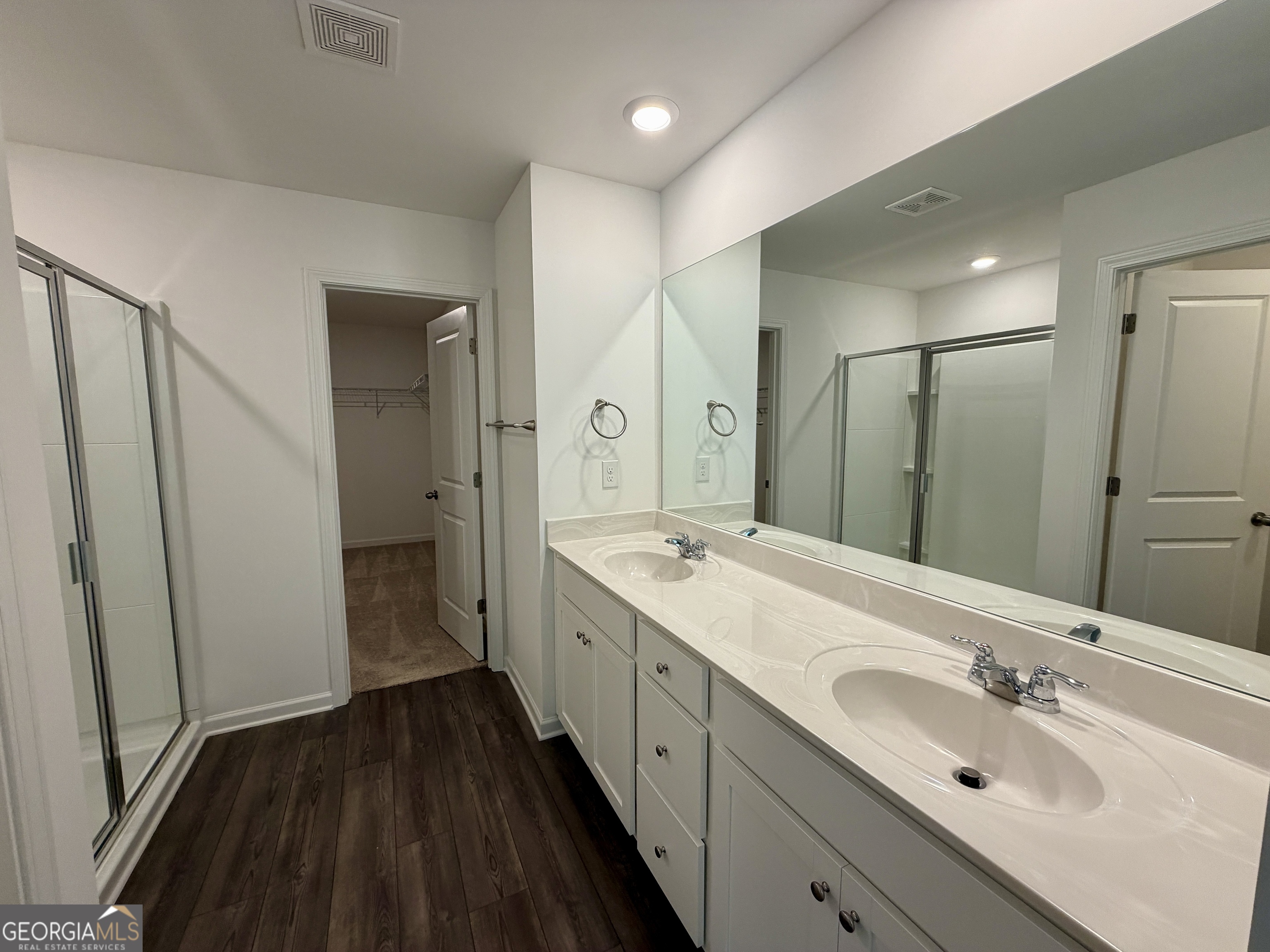 788 Gelderland Drive Hampton, GA 30228 - Photo 17 of 27 a spacious bathroom with a double vanity sink and mirror