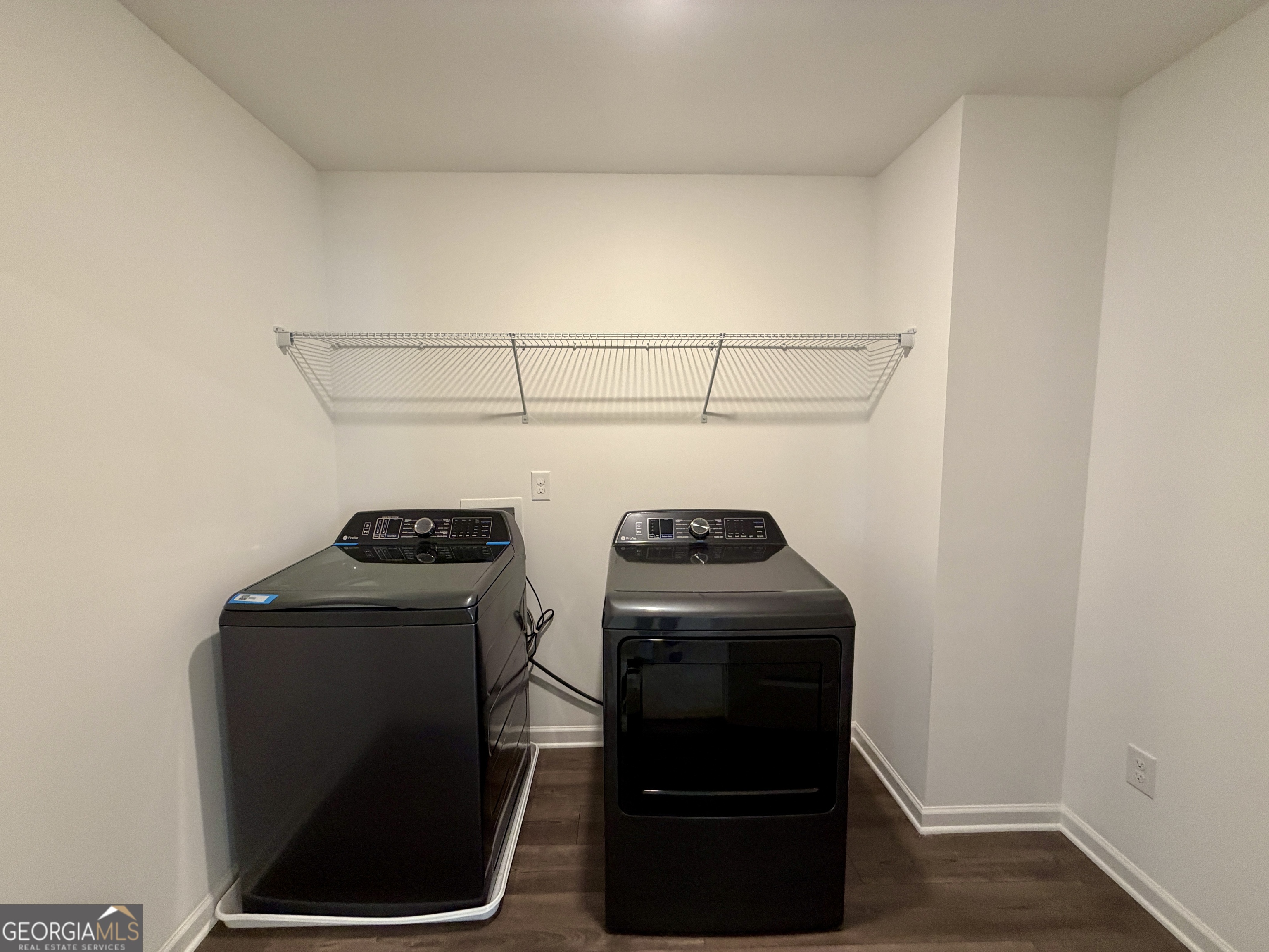 788 Gelderland Drive Hampton, GA 30228 - Photo 20 of 27 a view of storage and utility room with washer and dryer