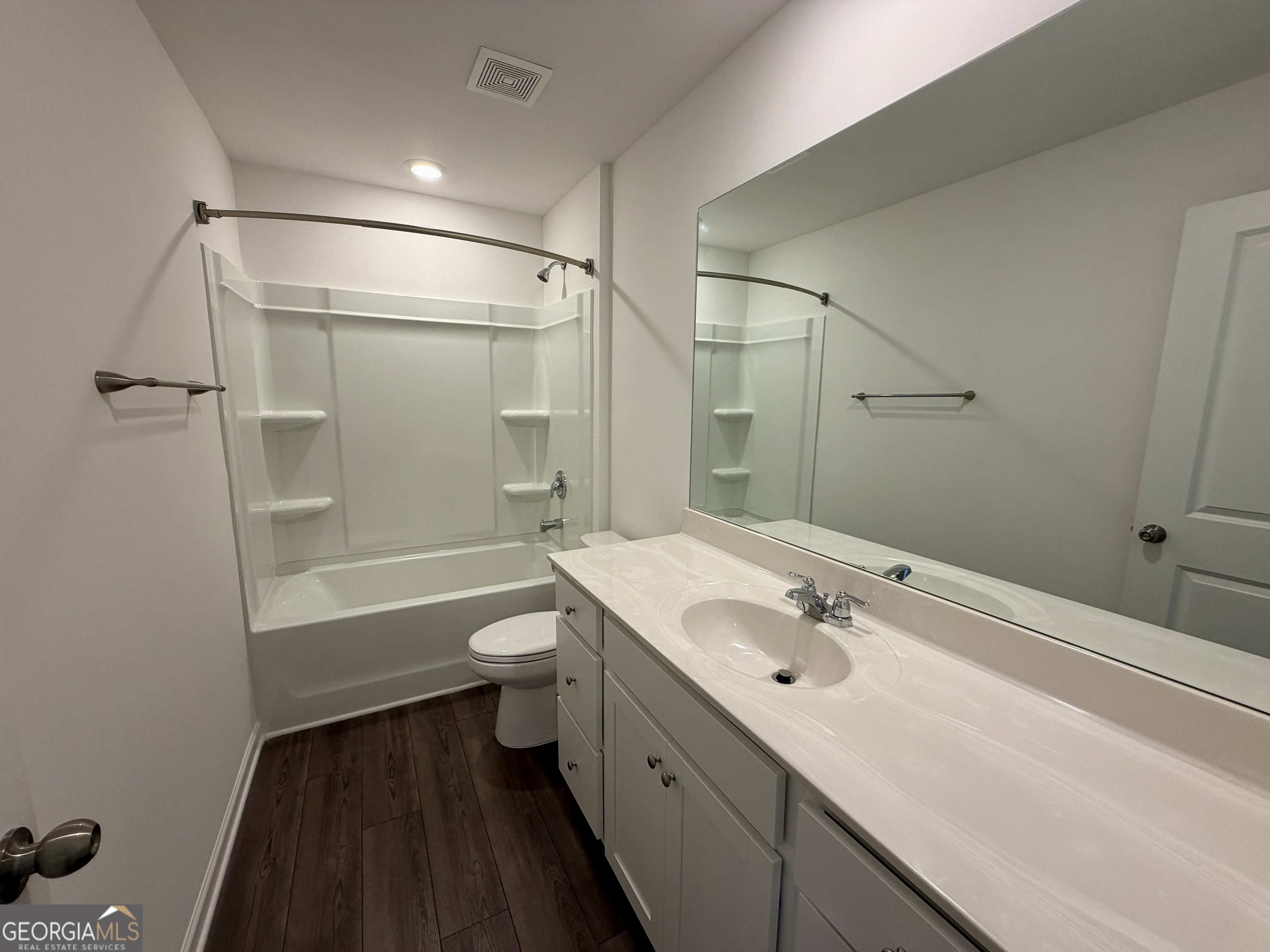 788 Gelderland Drive Hampton, GA 30228 - Photo 25 of 27 a bathroom with a double vanity sink toilet mirror and shower