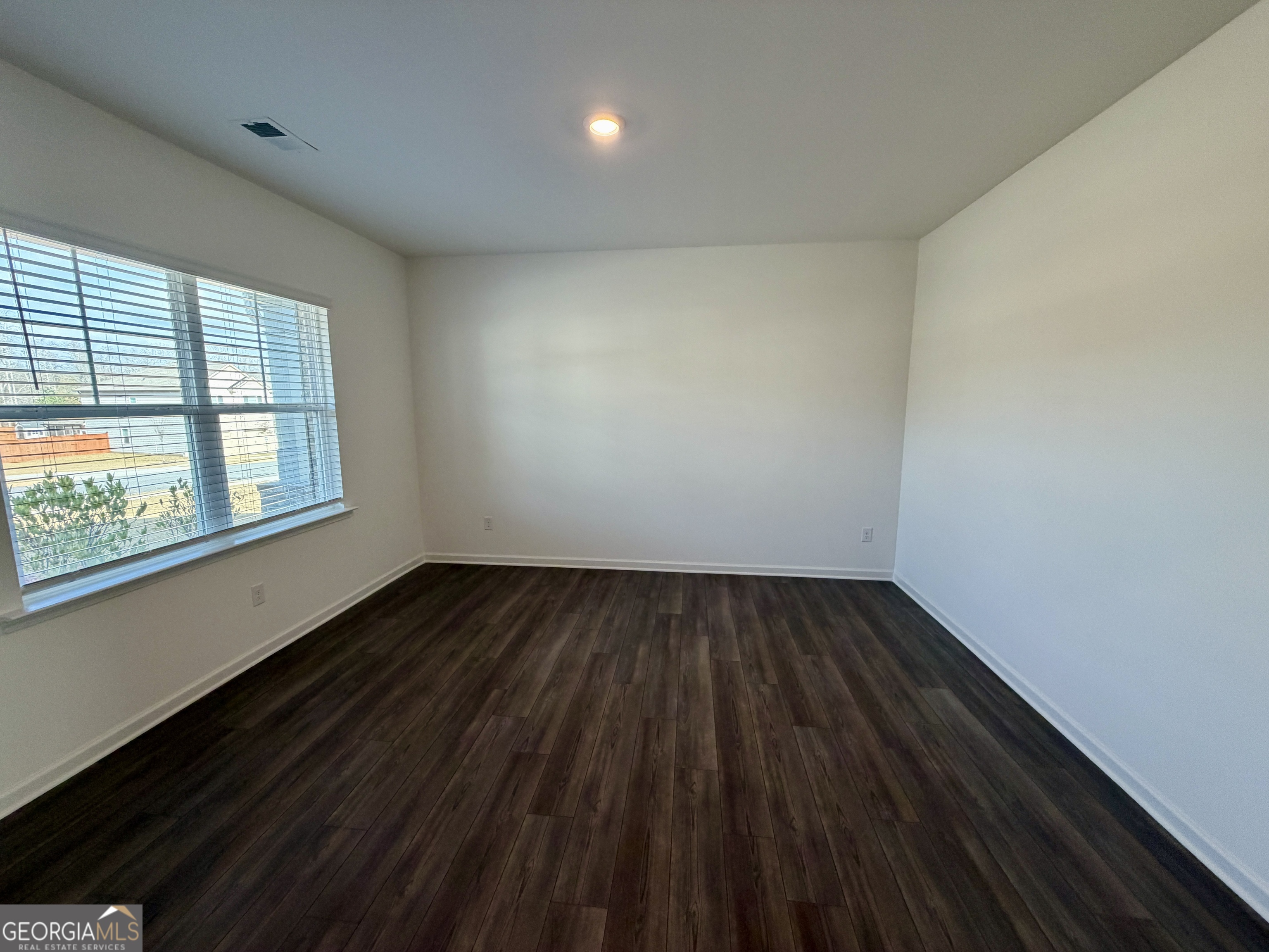 788 Gelderland Drive Hampton, GA 30228 - Photo 4 of 27 a view of an empty room and wooden floor