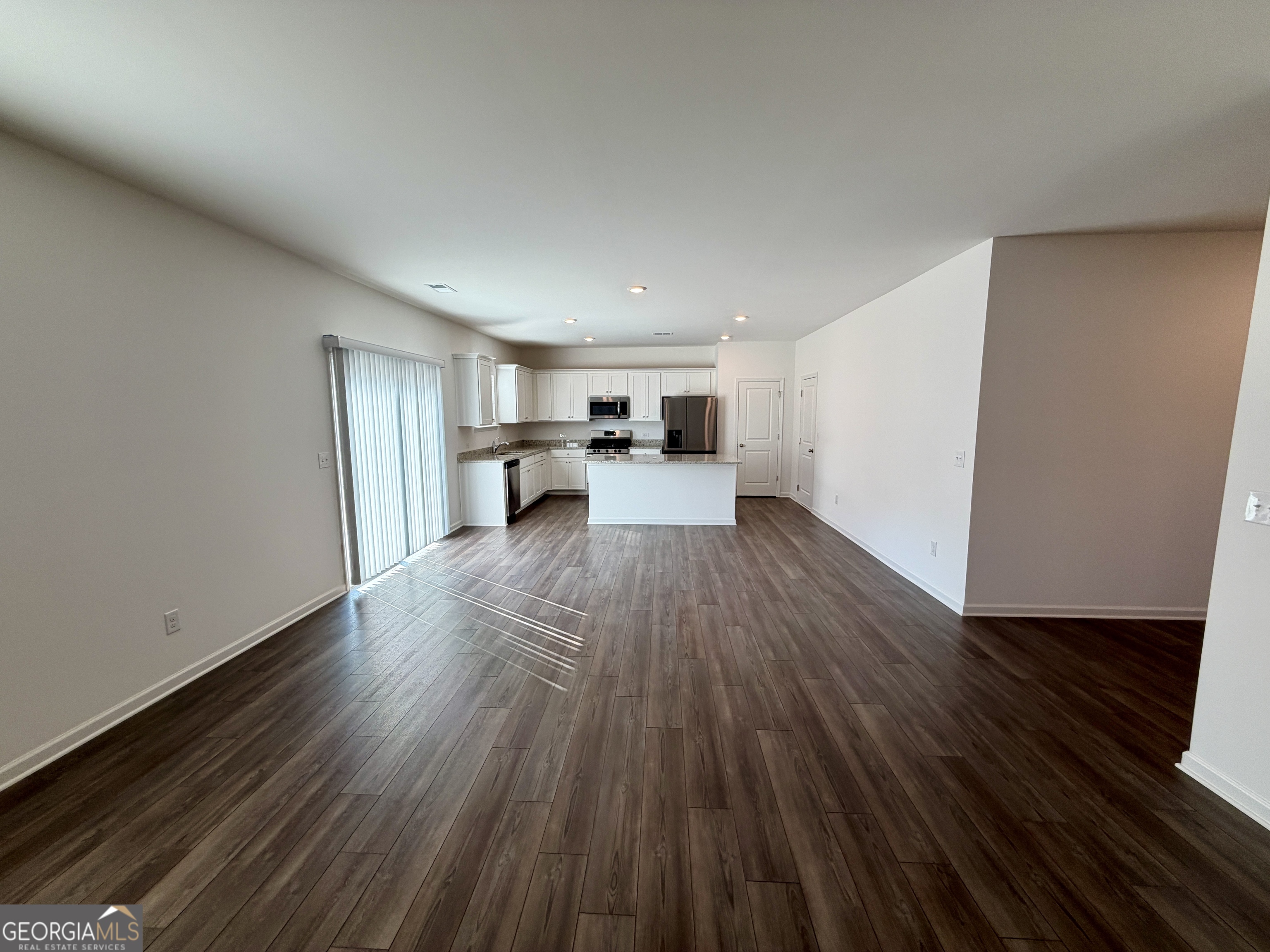 788 Gelderland Drive Hampton, GA 30228 - Photo 6 of 27 a view of a living room with wooden floor