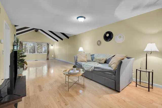 a view of a dining room with furniture and a fireplace