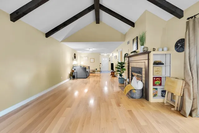 an aerial view of a house with yard and ocean view