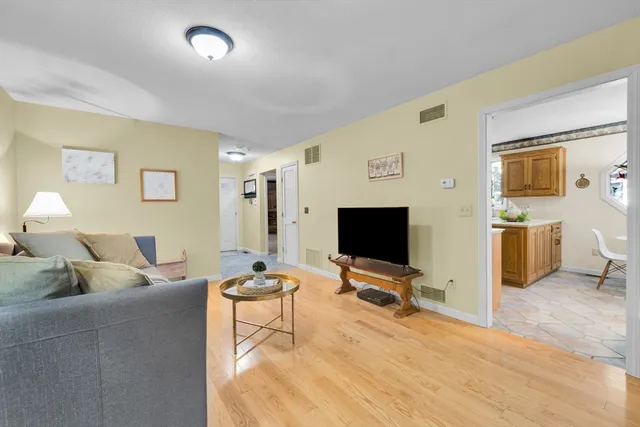 a kitchen with a sink a stove and cabinets