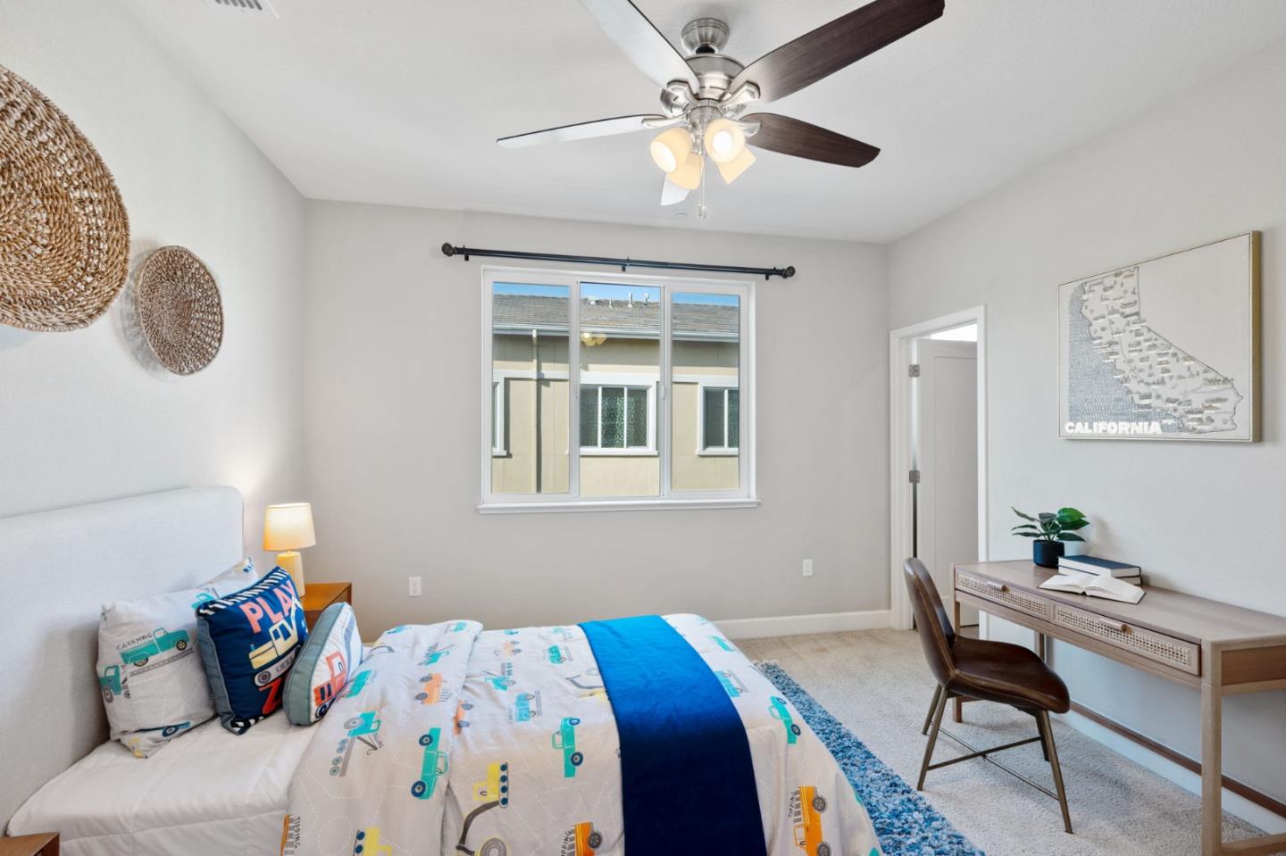 5977 Larkstone Loop San Jose, CA 95123 - Photo 33 of 63 a bedroom that has a bed and a table in it