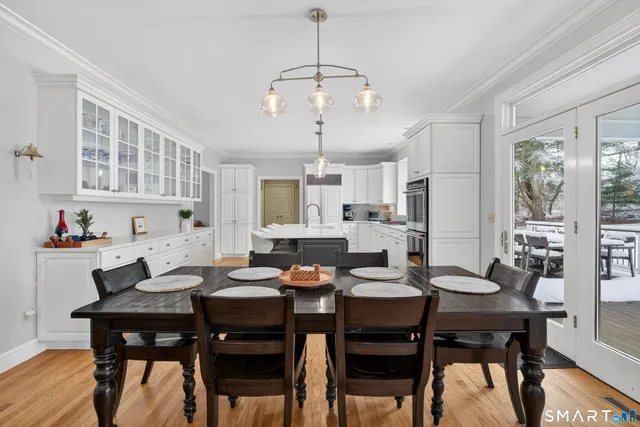 a view of a dining room with furniture and wooden floor