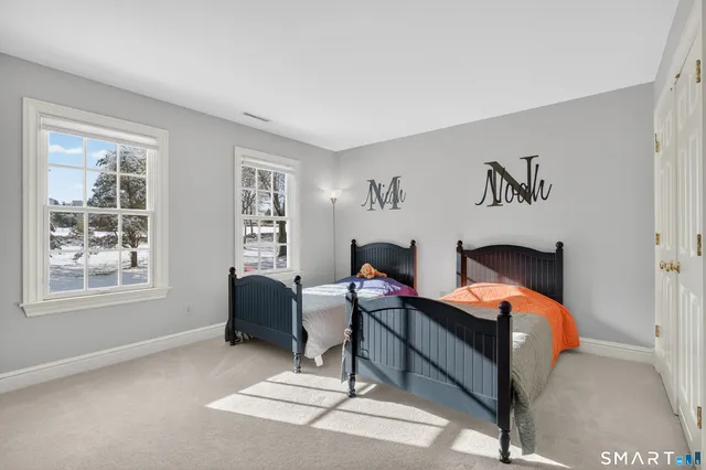 a bedroom with furniture and a window