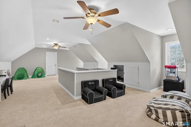 a bedroom with furniture and a chandelier